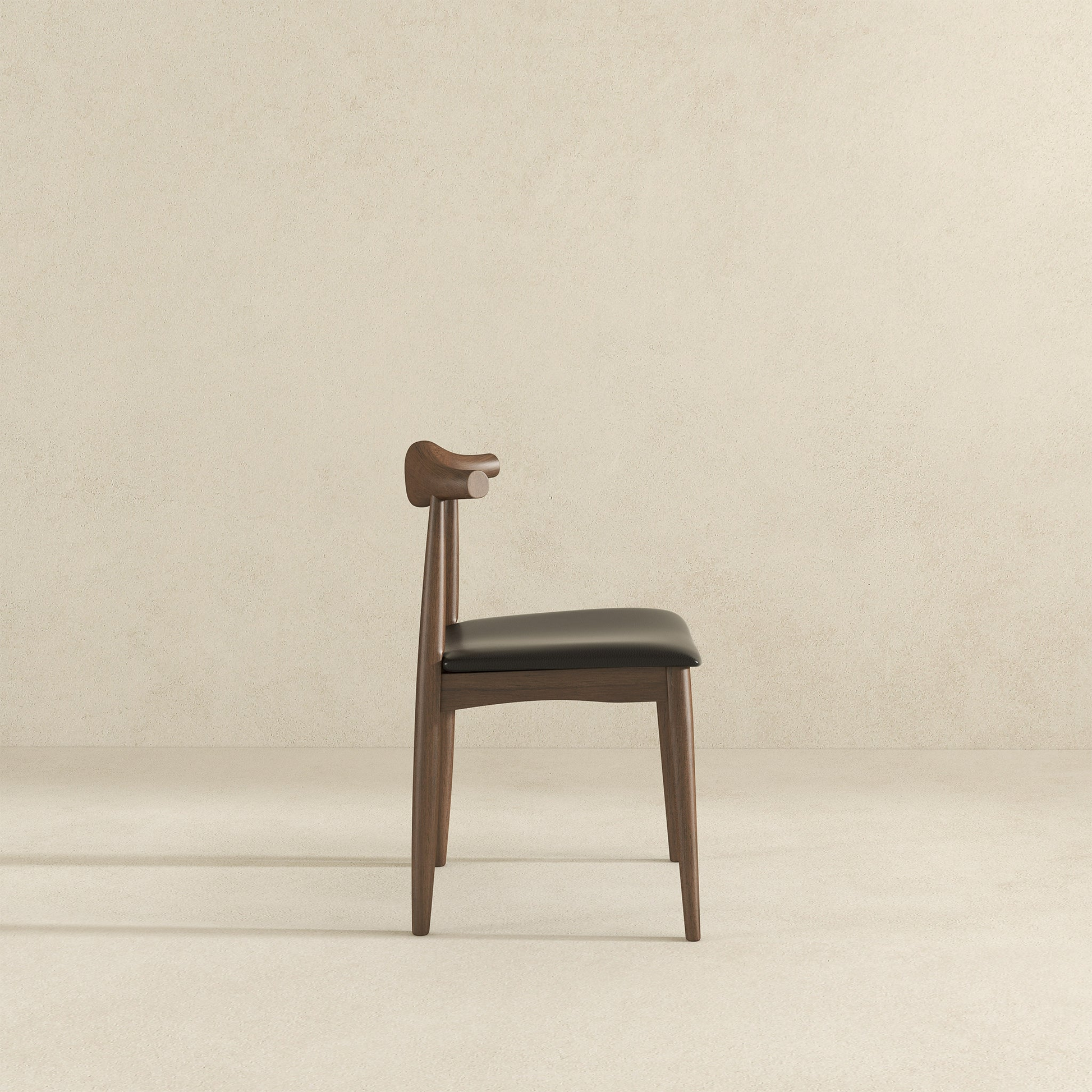 Modern wooden dining chair with black faux leather seat curved backrest