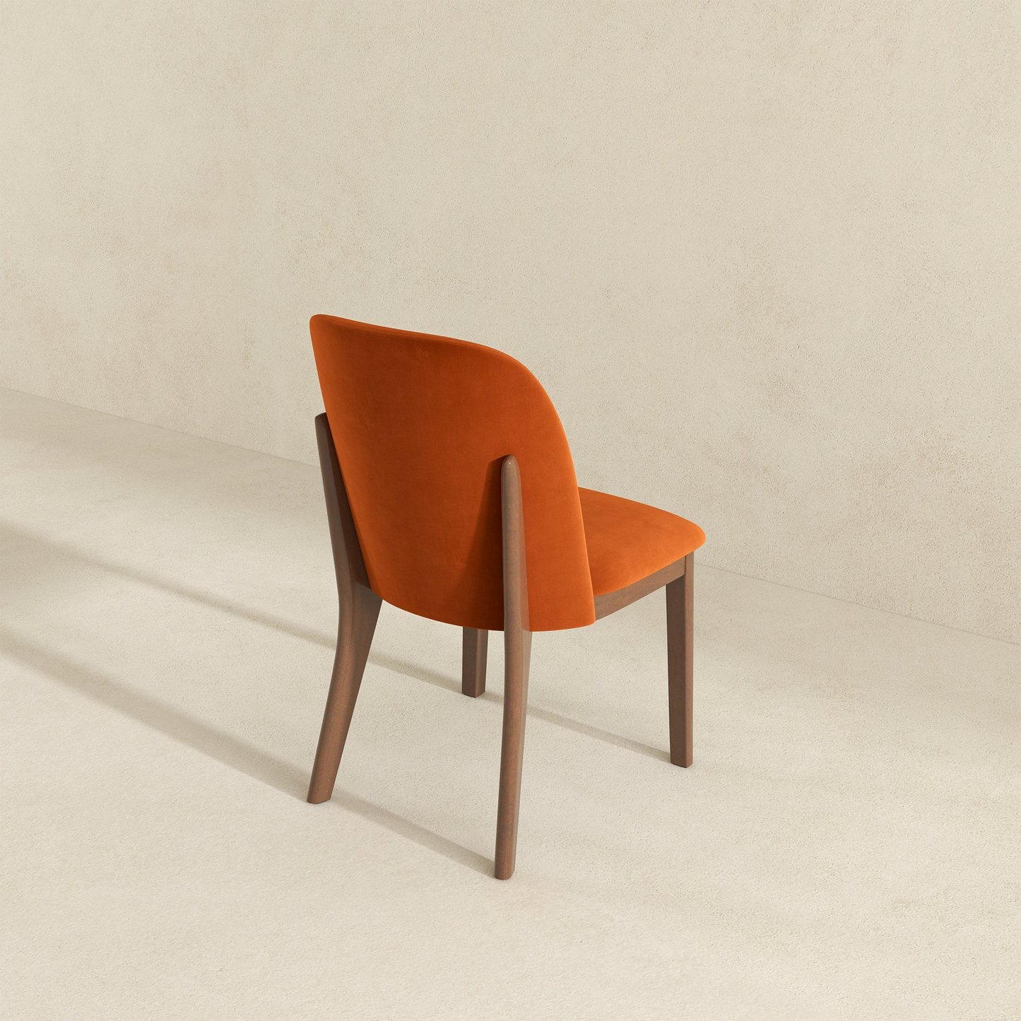 Orange velvet dining chair with dark wood legs modern design
