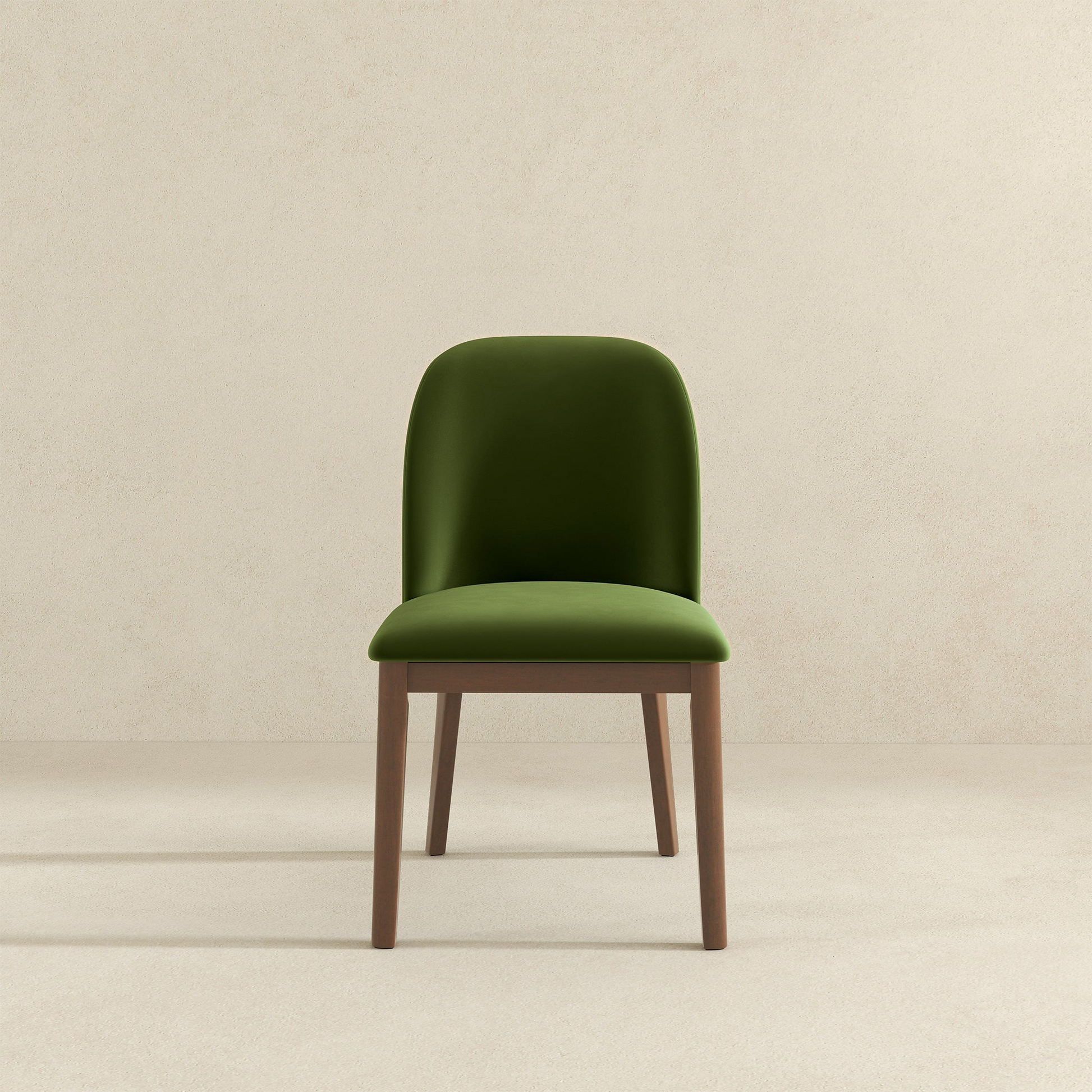 Green velvet dining chair with wooden legs perfect for modern kitchens