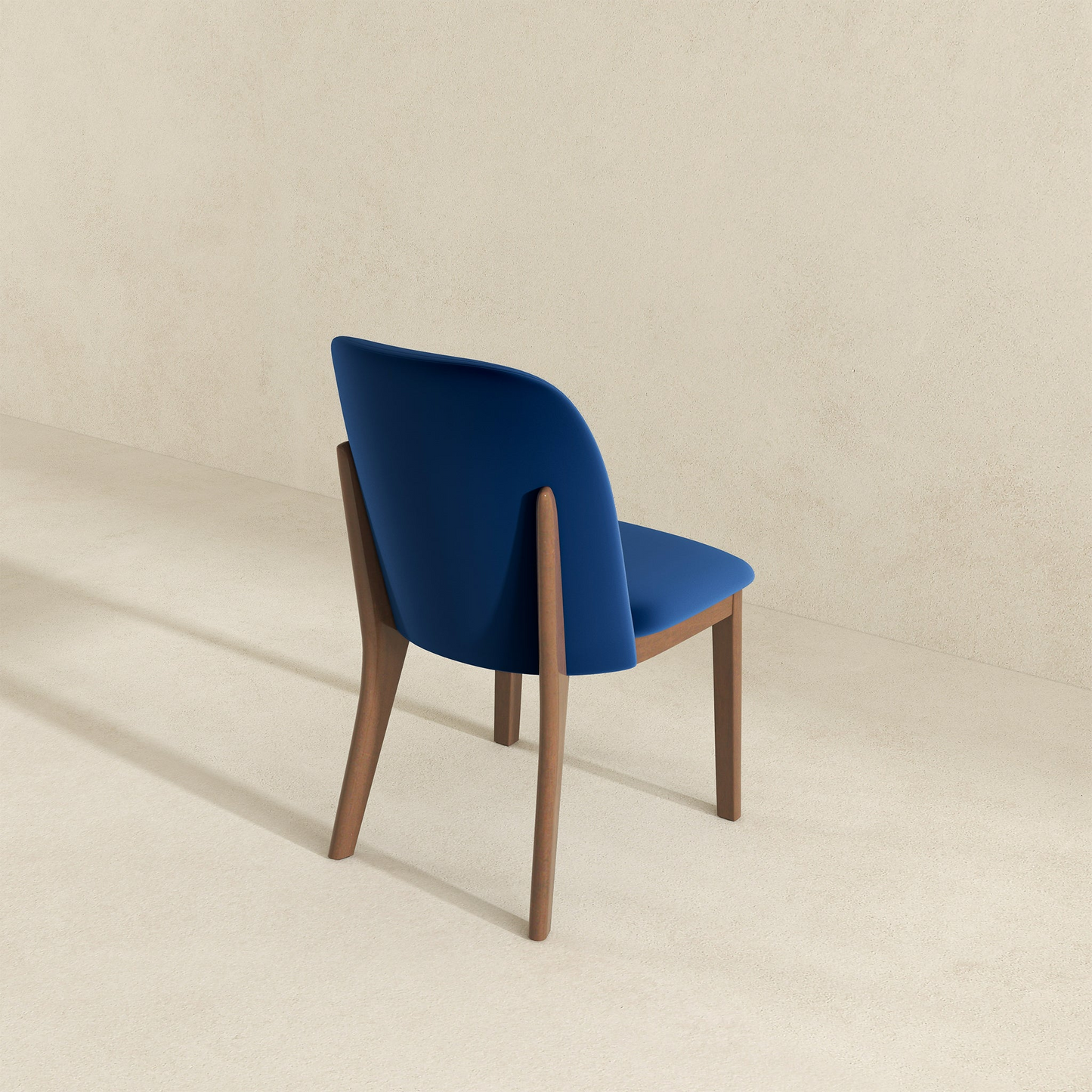 Midcentury modern dining chair with dark blue upholstery and walnut wood legs