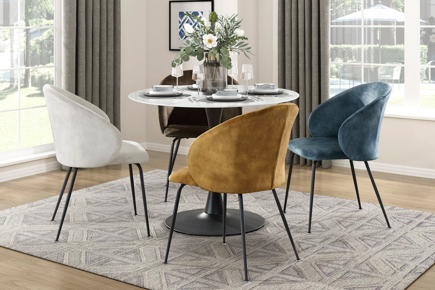 Plush velvet dining chair in deep teal featuring a sleek silhouette and black metal legs