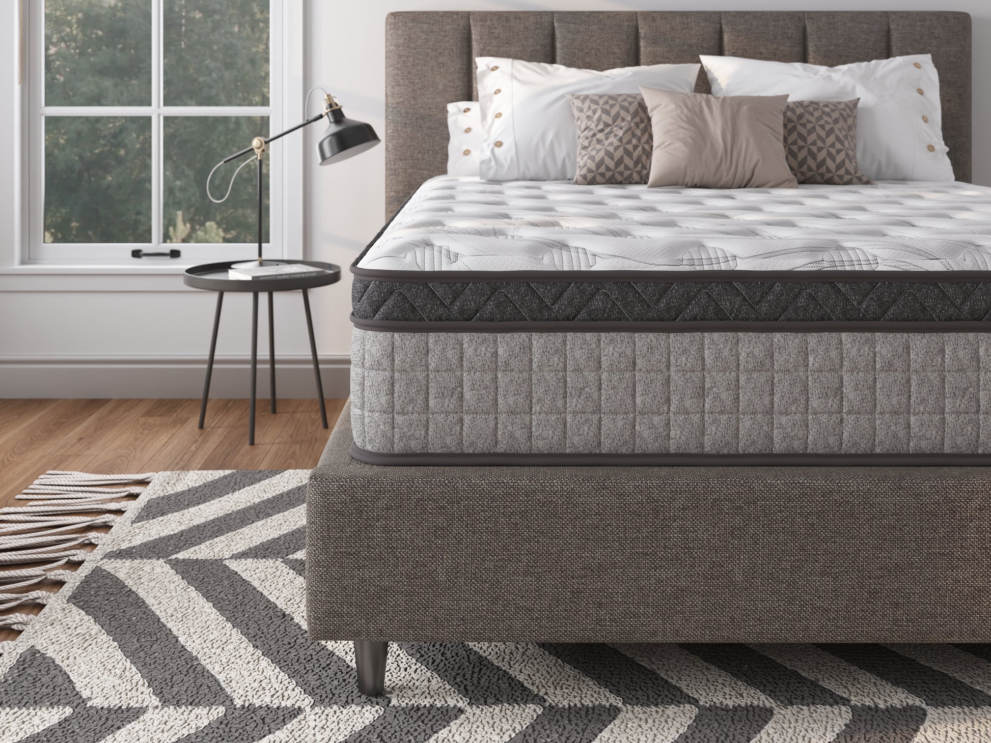 Modern queen mattress with white quilted top and grey sides offering ultimate comfort