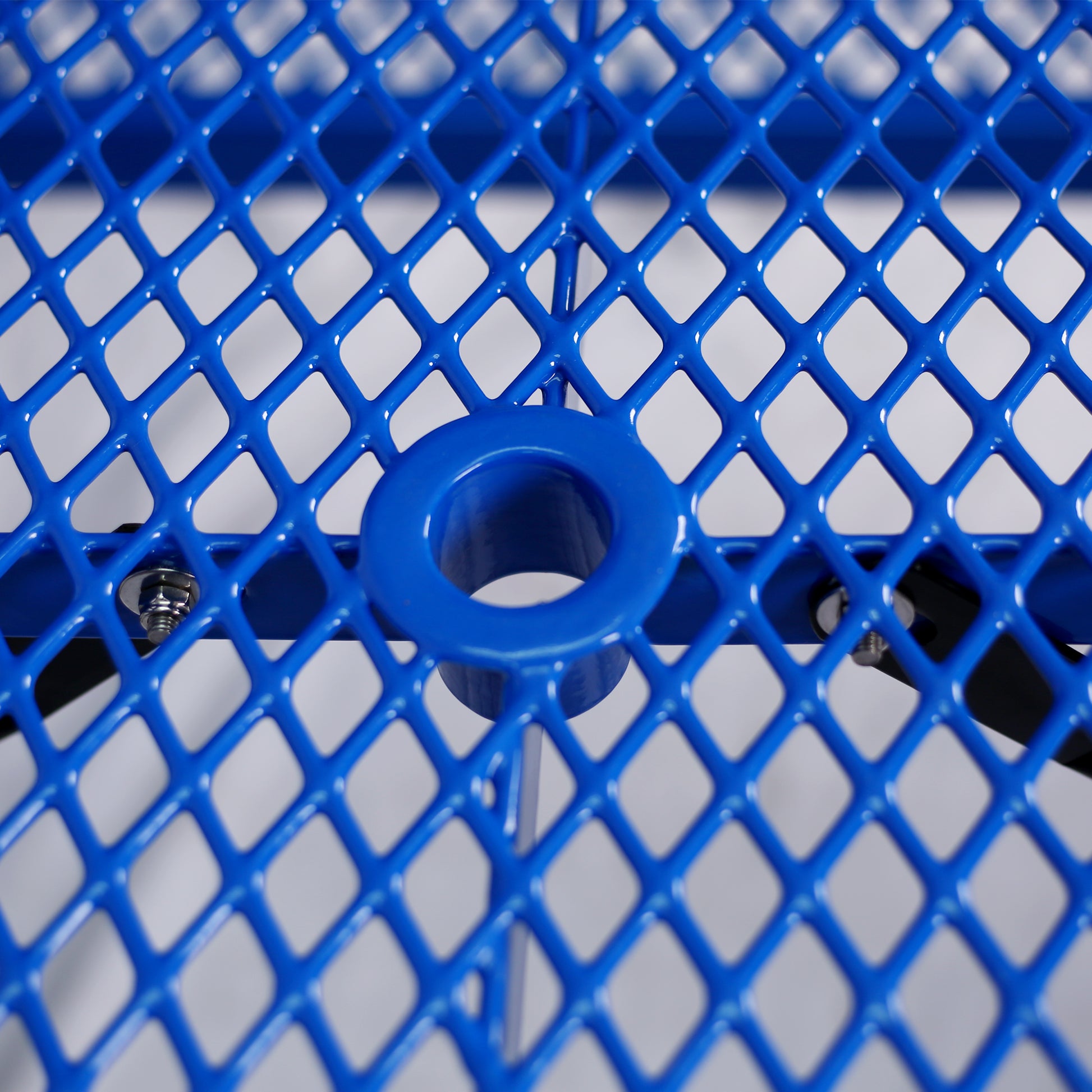 Bright blue diamondpatterned mesh tabletop with a central hole for an umbrella stand
