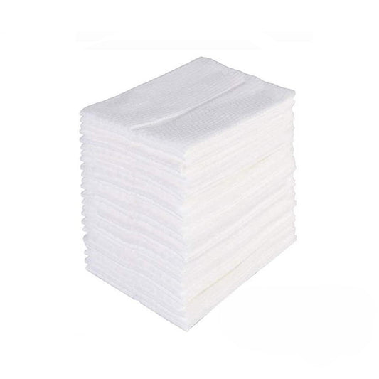 Stack of  white disposable gauze pads for wound care