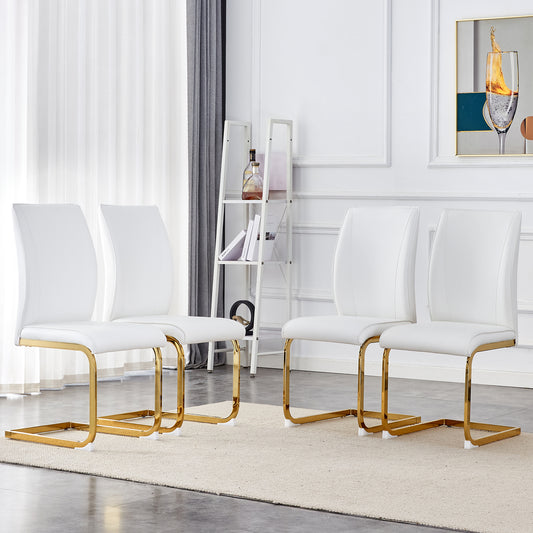 Set of four white faux leather dining chairs with gold metal sled legs