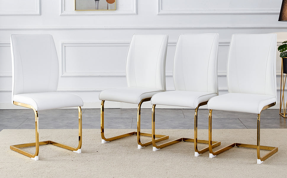 Four white faux leather dining chairs with polished gold cantilever legs elegant and modern