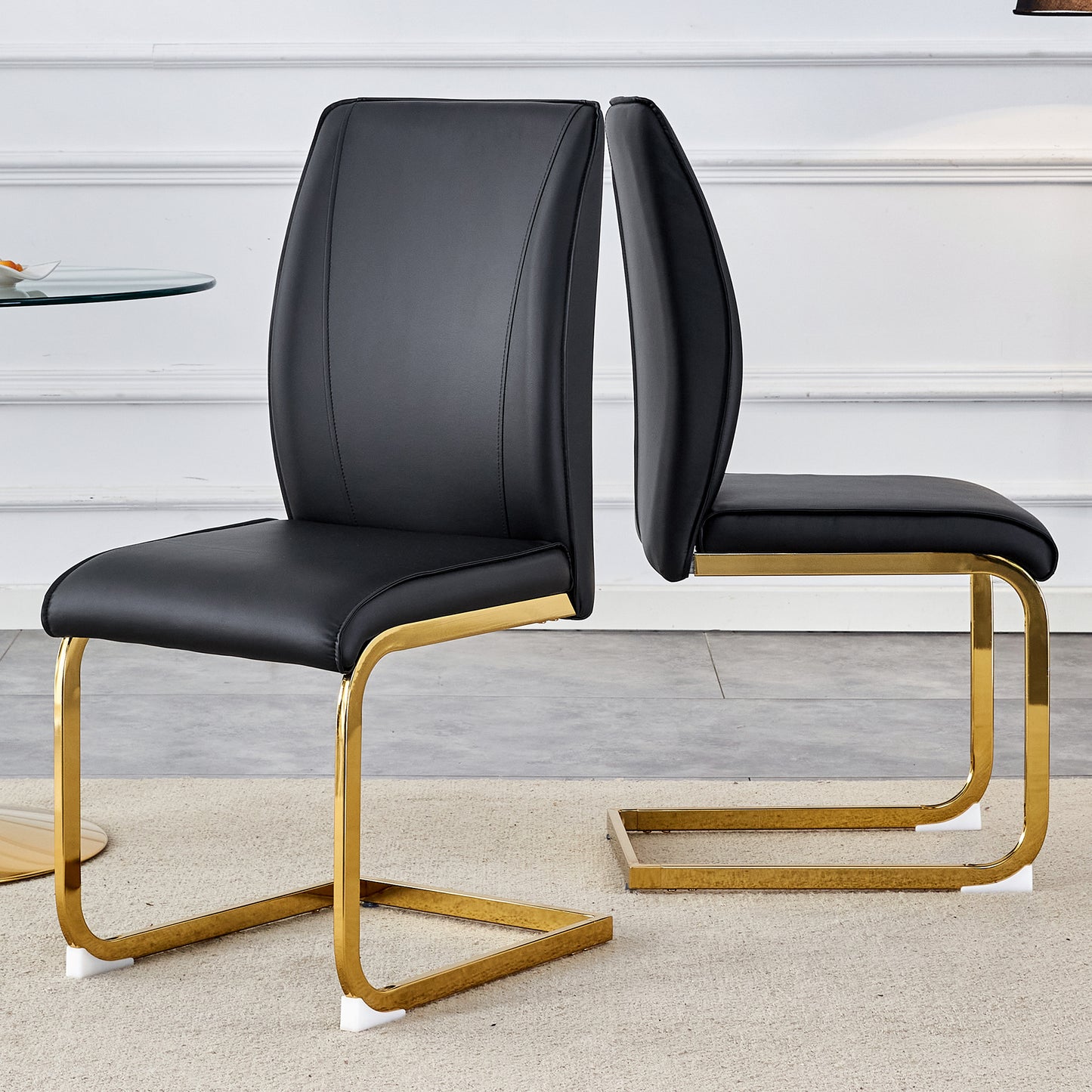 Black leather cantilever chair with polished gold frame