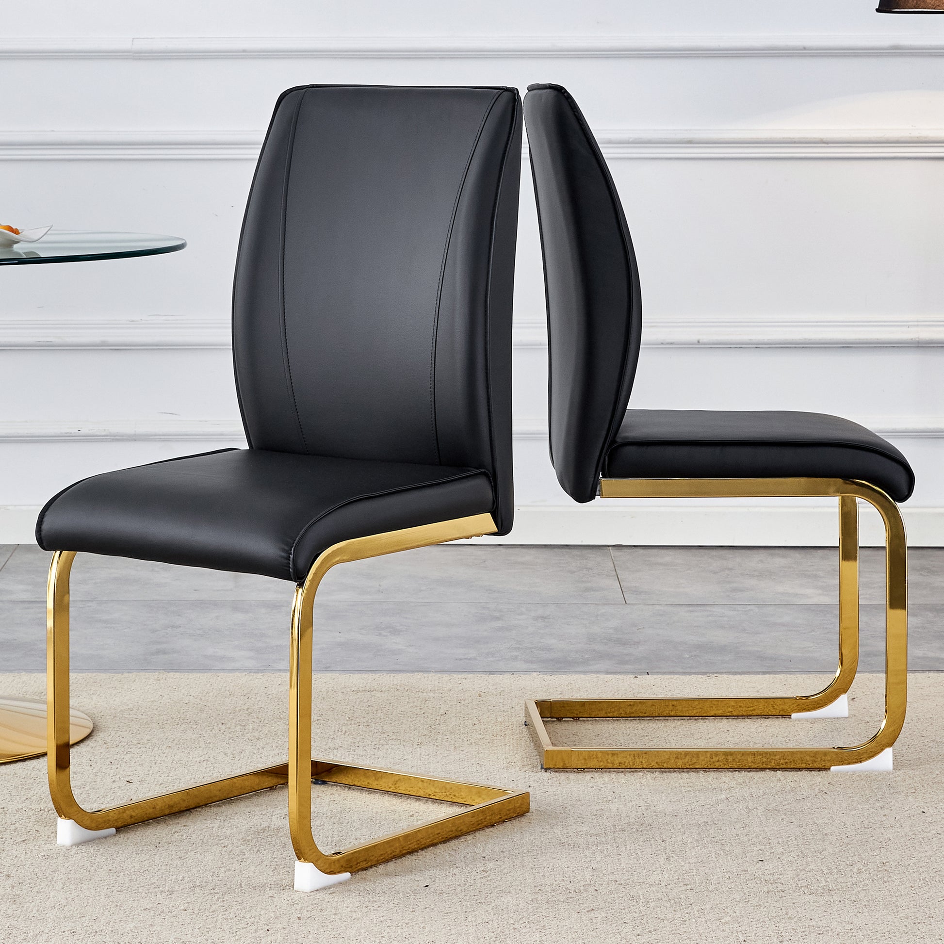 Black leather cantilever chair with polished gold frame