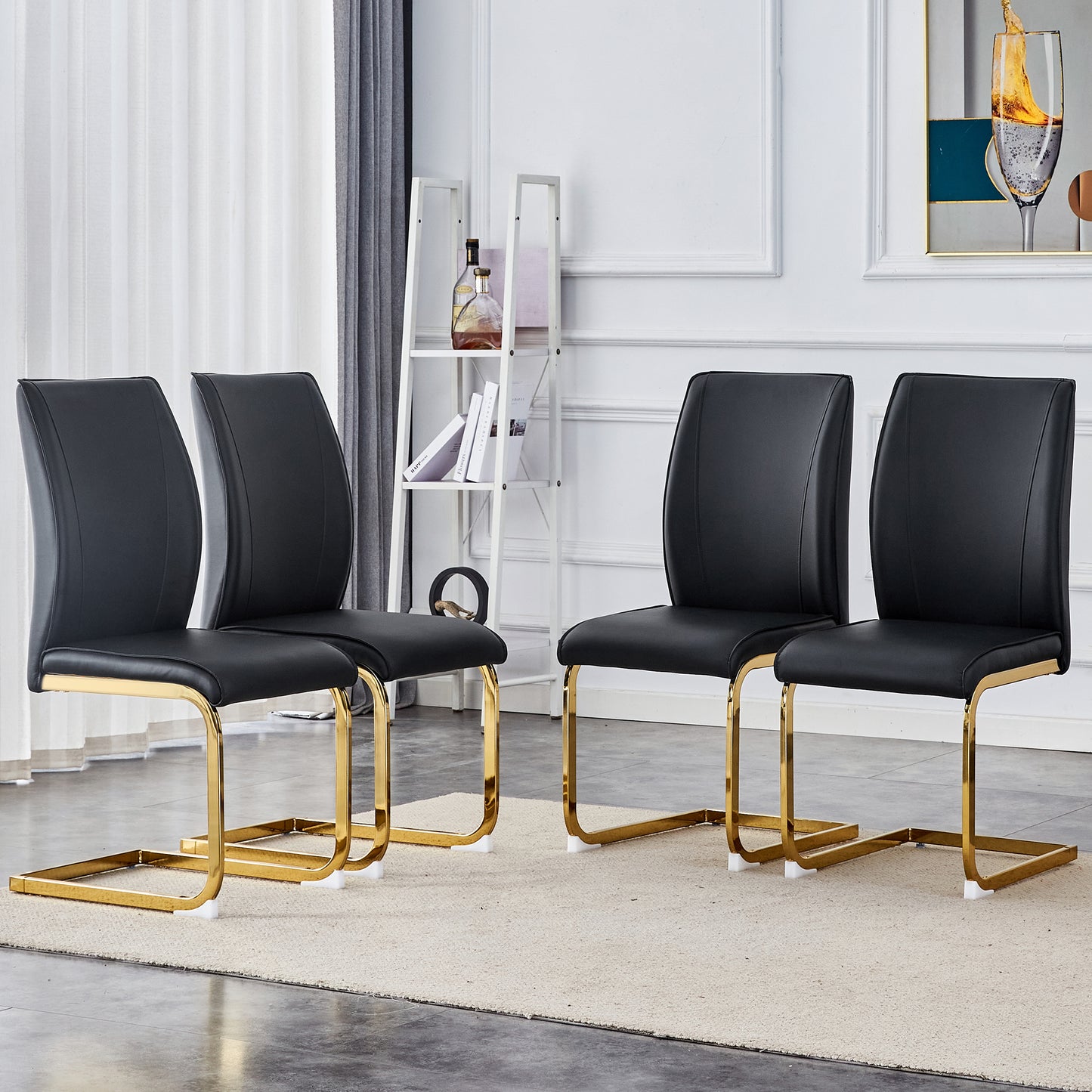 Four modern black leather dining chairs with gold sled bases