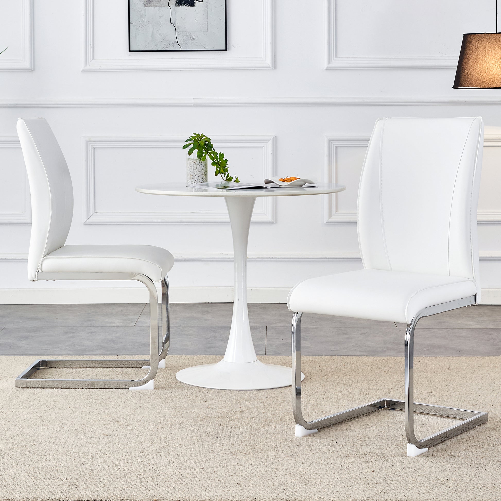 Modern white faux leather dining chair with sleek chrome sled base