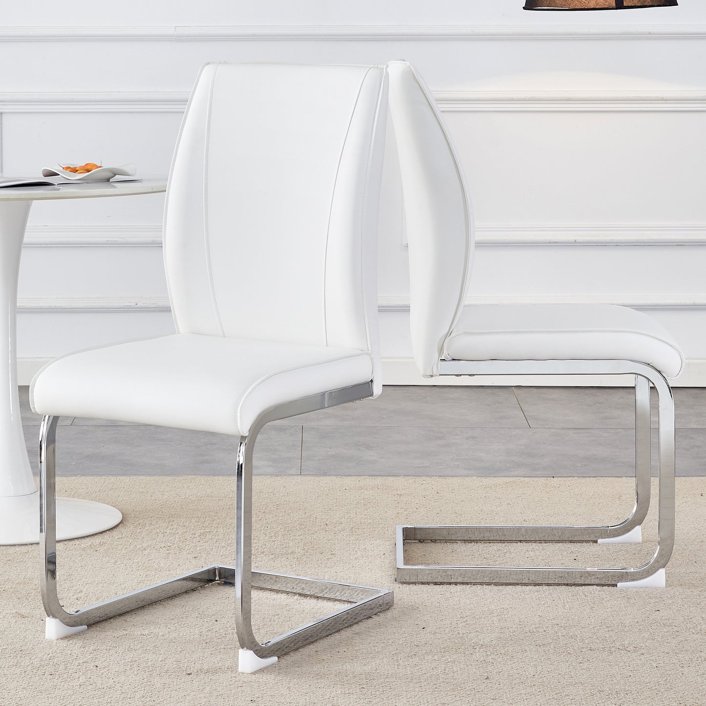 White leather dining chair with sleek chrome cantilever base for modern homes