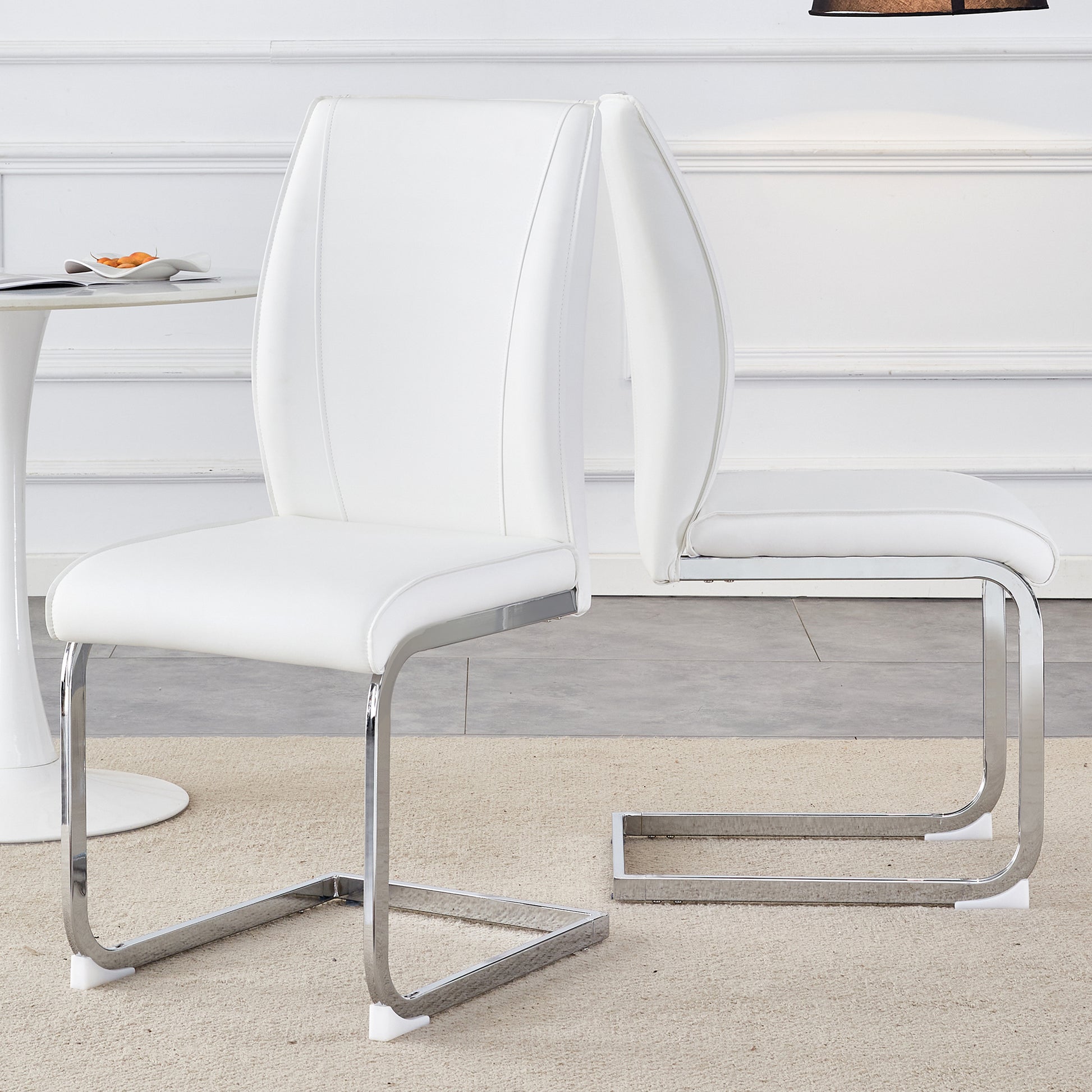 White leather dining chair with sleek chrome cantilever base for modern homes