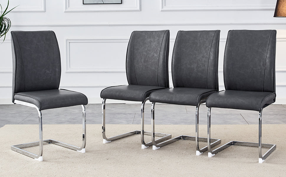 Four grey faux leather dining chairs with chrome cantilever legs