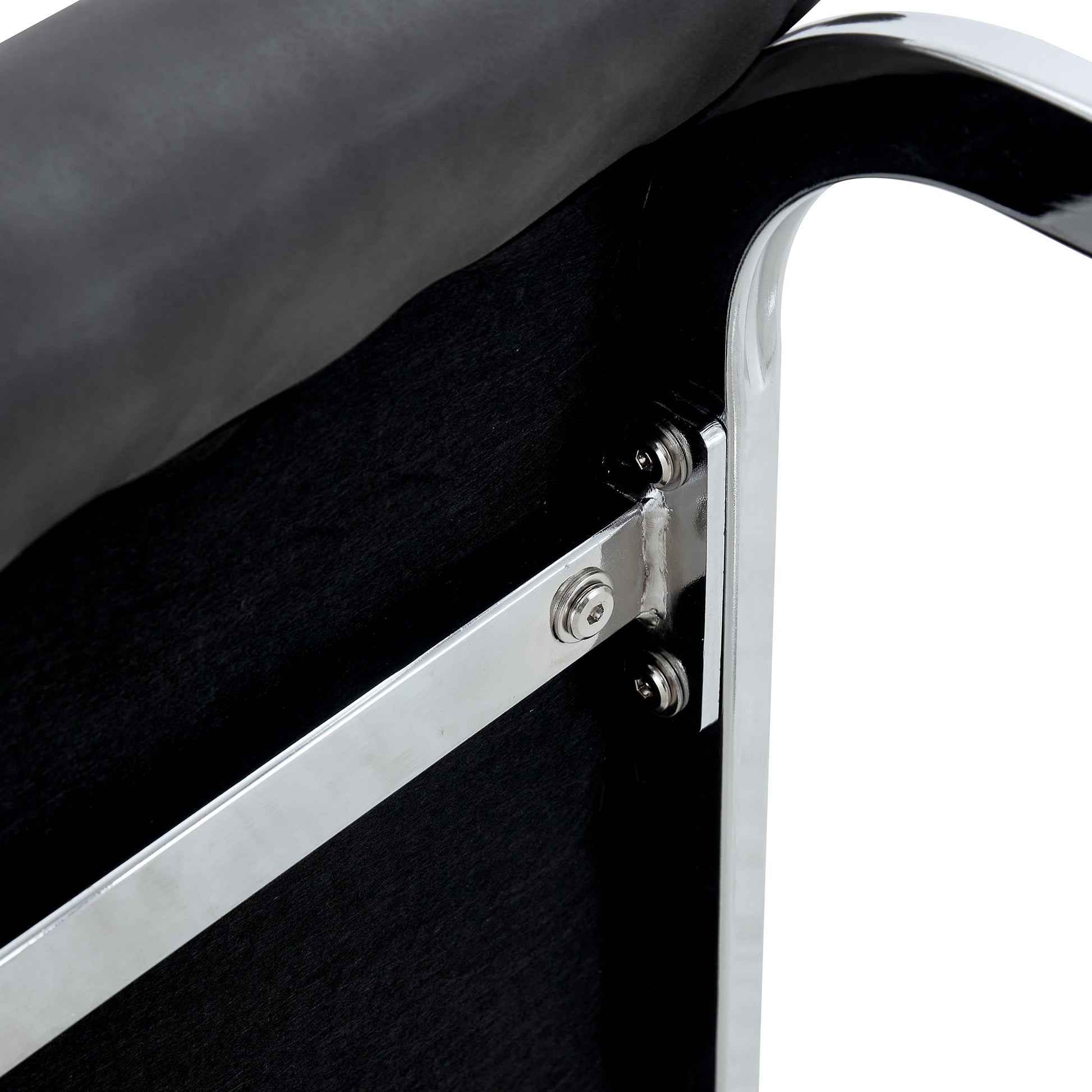 Black faux leather chair seat with polished chrome frame and visible screws