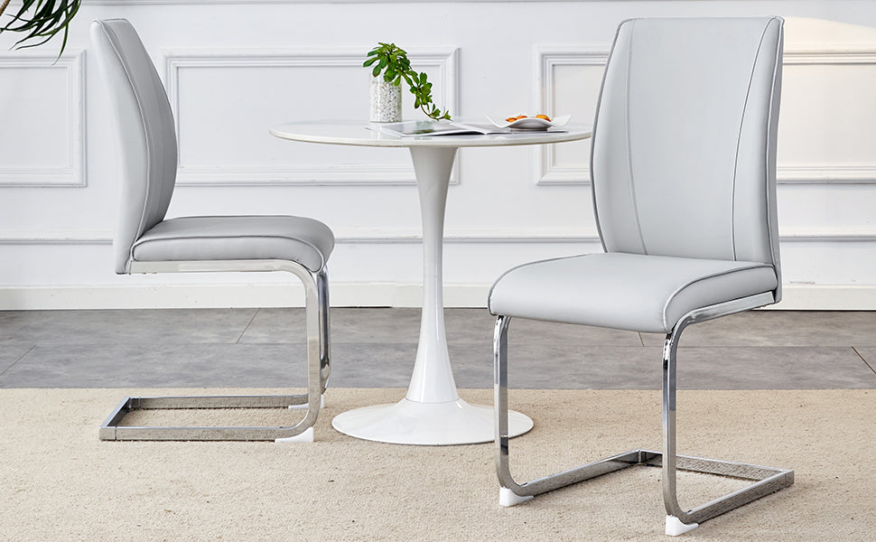 Light grey faux leather dining chair with chrome cantilever base