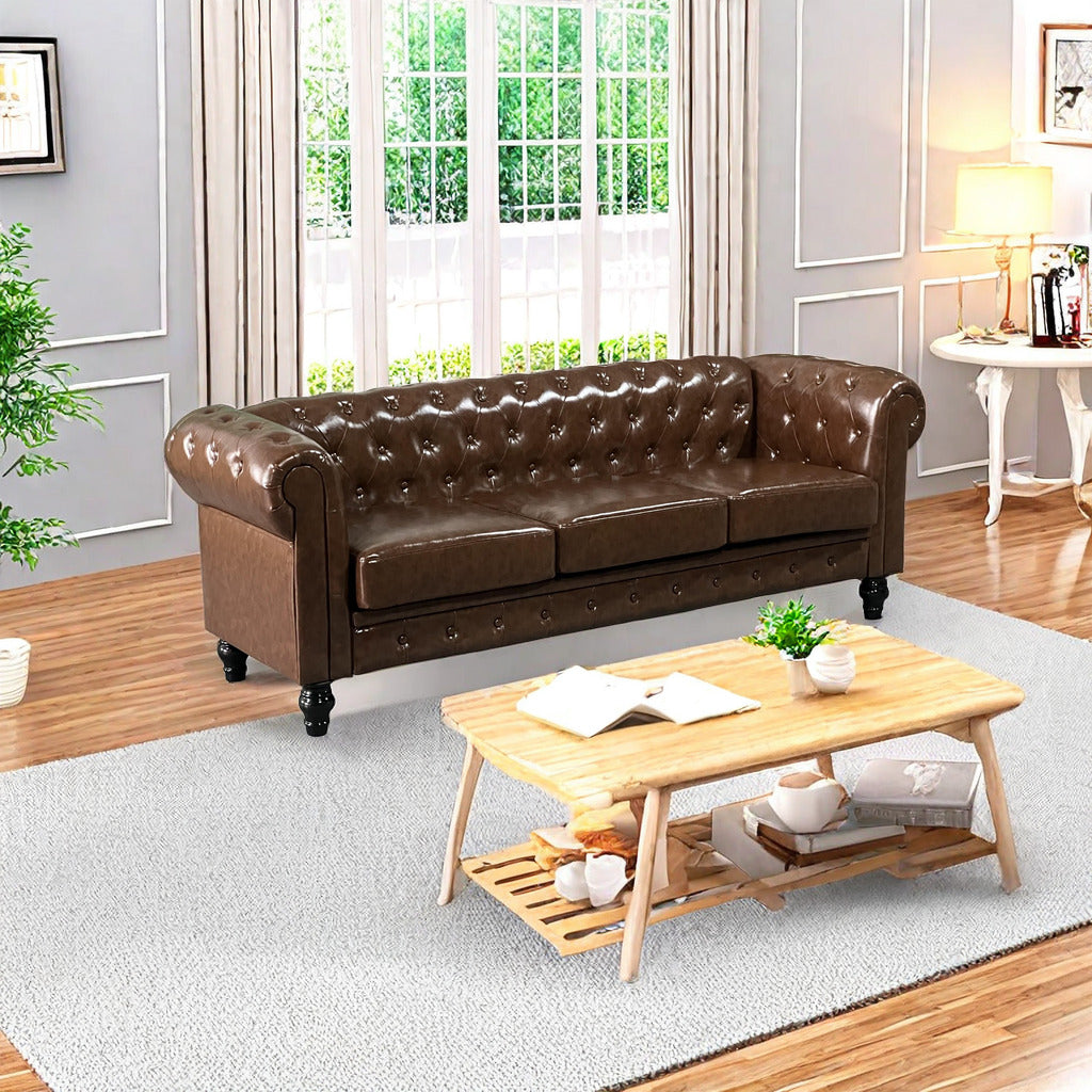 Brown tufted leather chesterfield sofa with rolled arms and dark wood legs