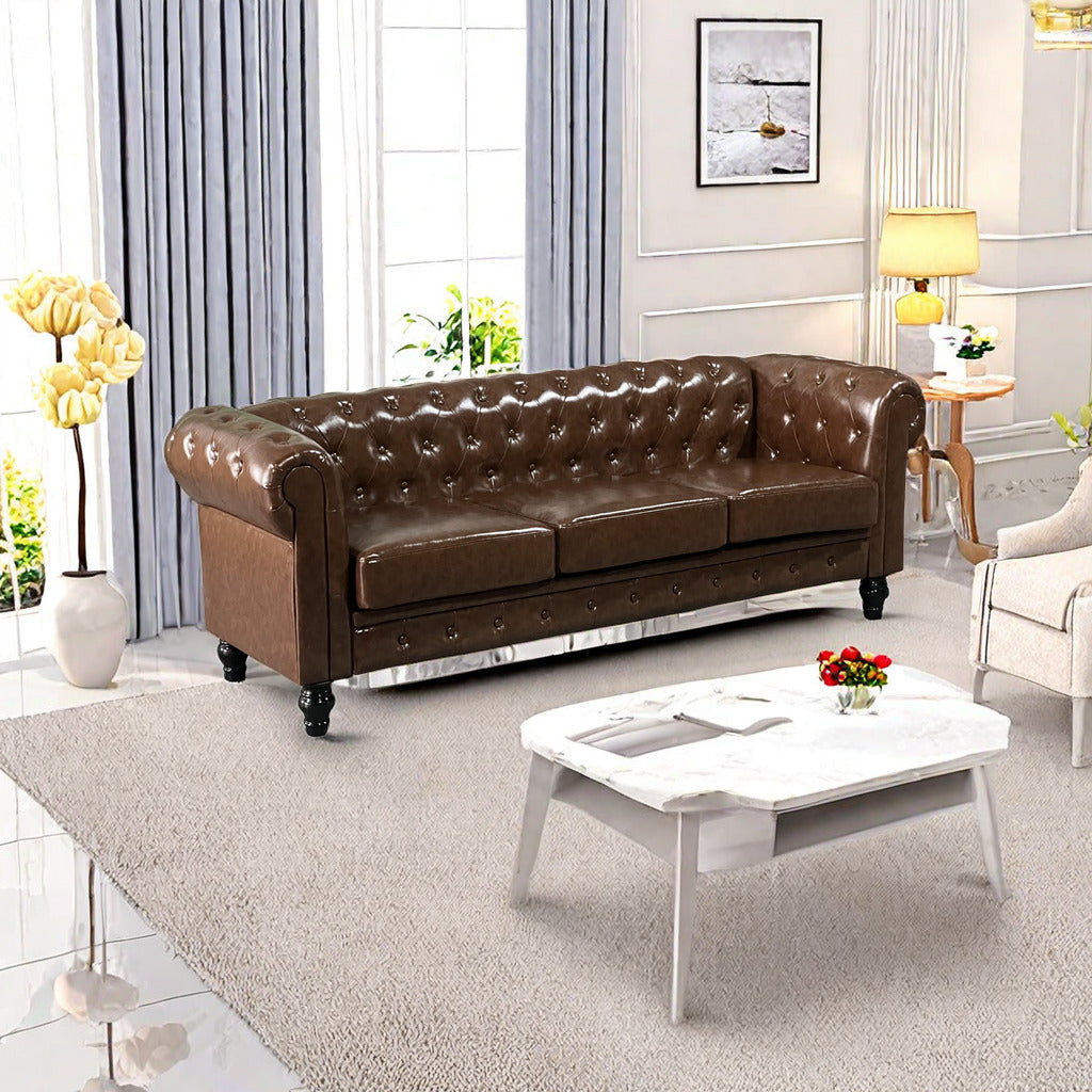 Brown leather chesterfield sofa with tufted details and silver nailhead trim