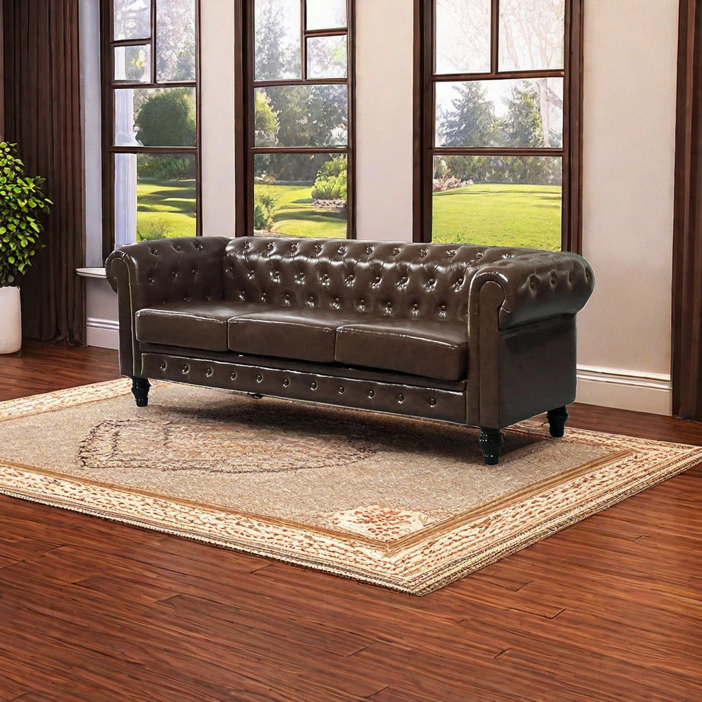 Brown leather chesterfield sofa with button tufting and rolled arms