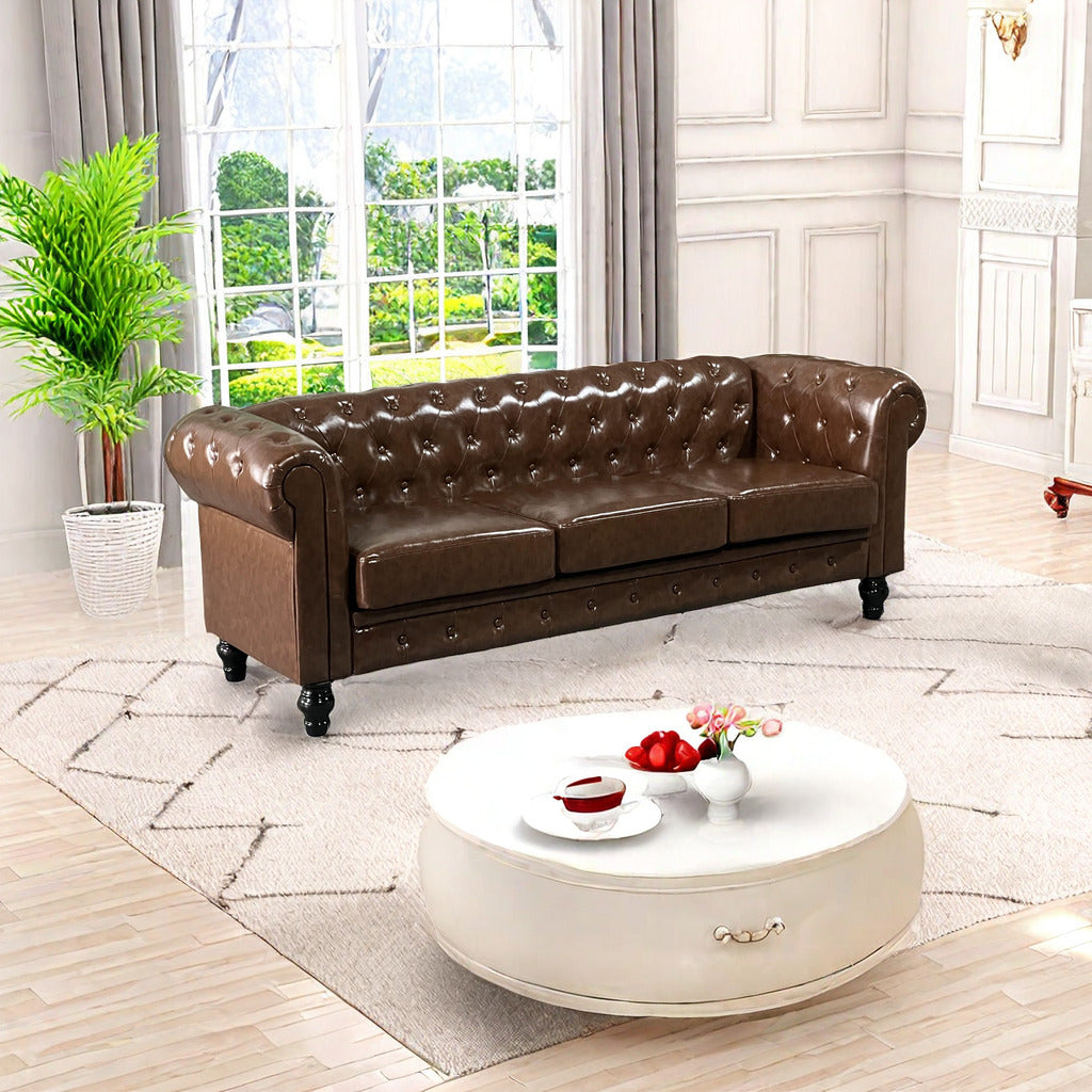 Brown leather chesterfield sofa with deep button tufting and rolled arms