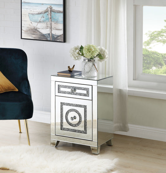 Mirrored accent cabinet with crystal drawer knob and decorative front panel