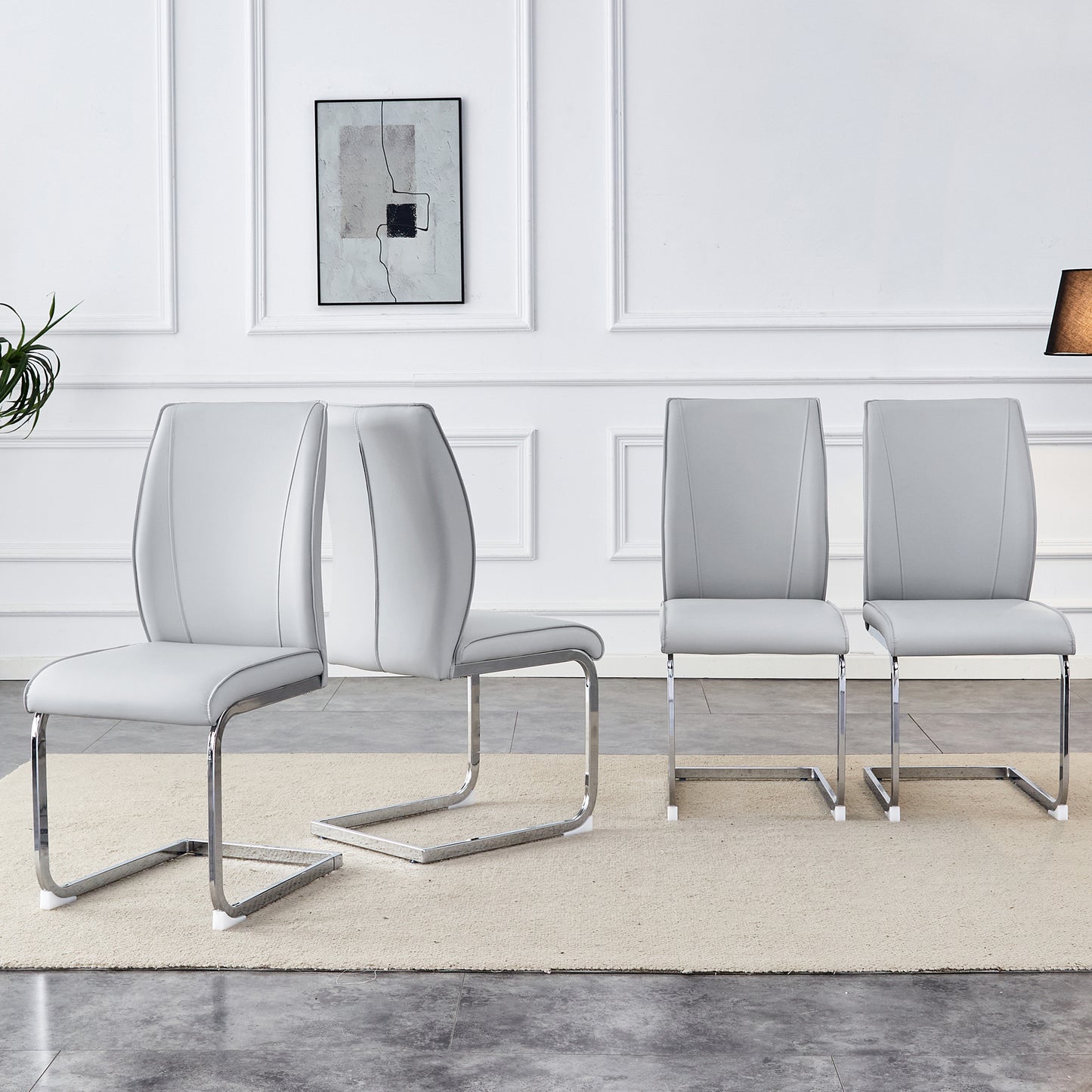 Set of  modern grey faux leather dining chairs with chrome cantilever bases