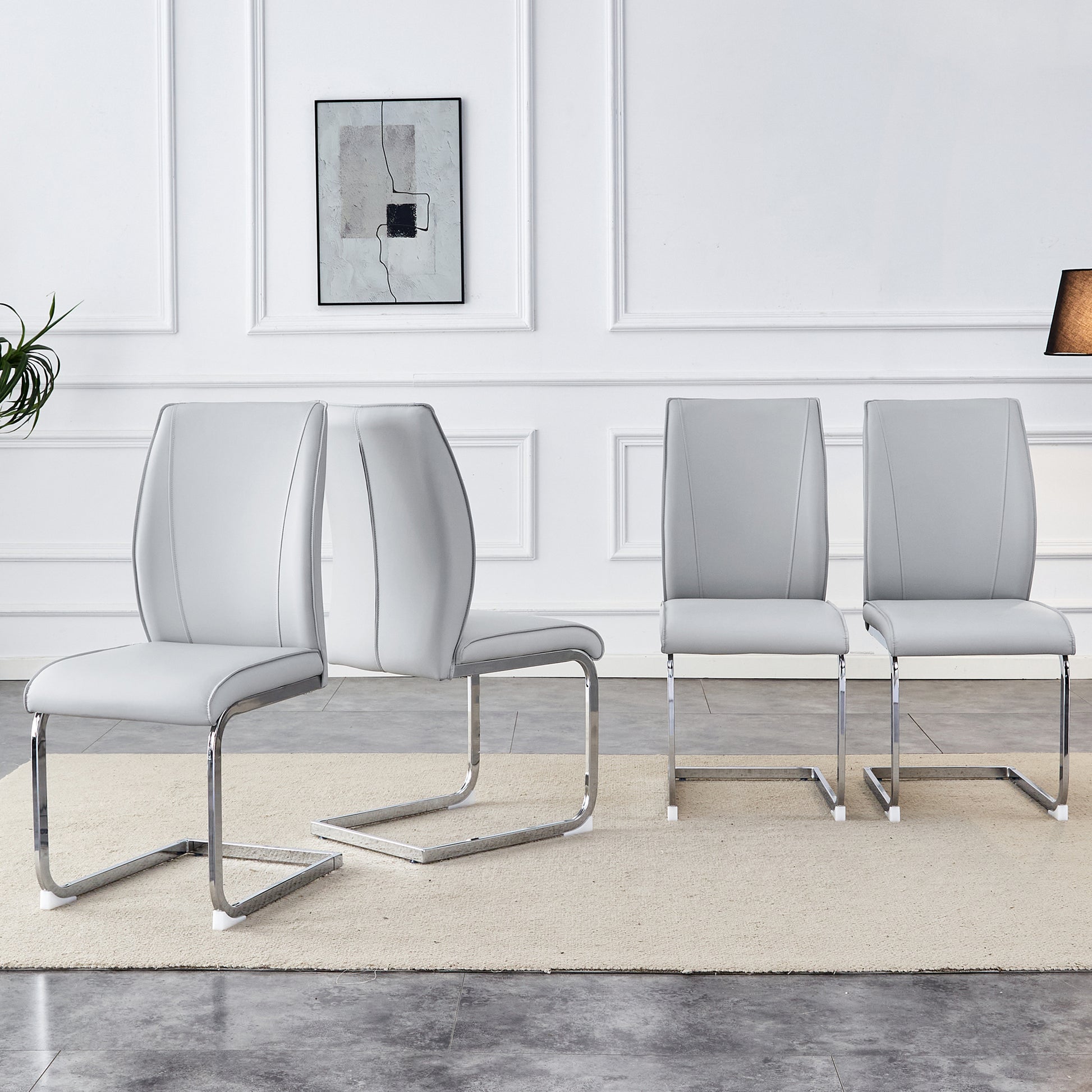 Set of  modern grey faux leather dining chairs with chrome cantilever bases