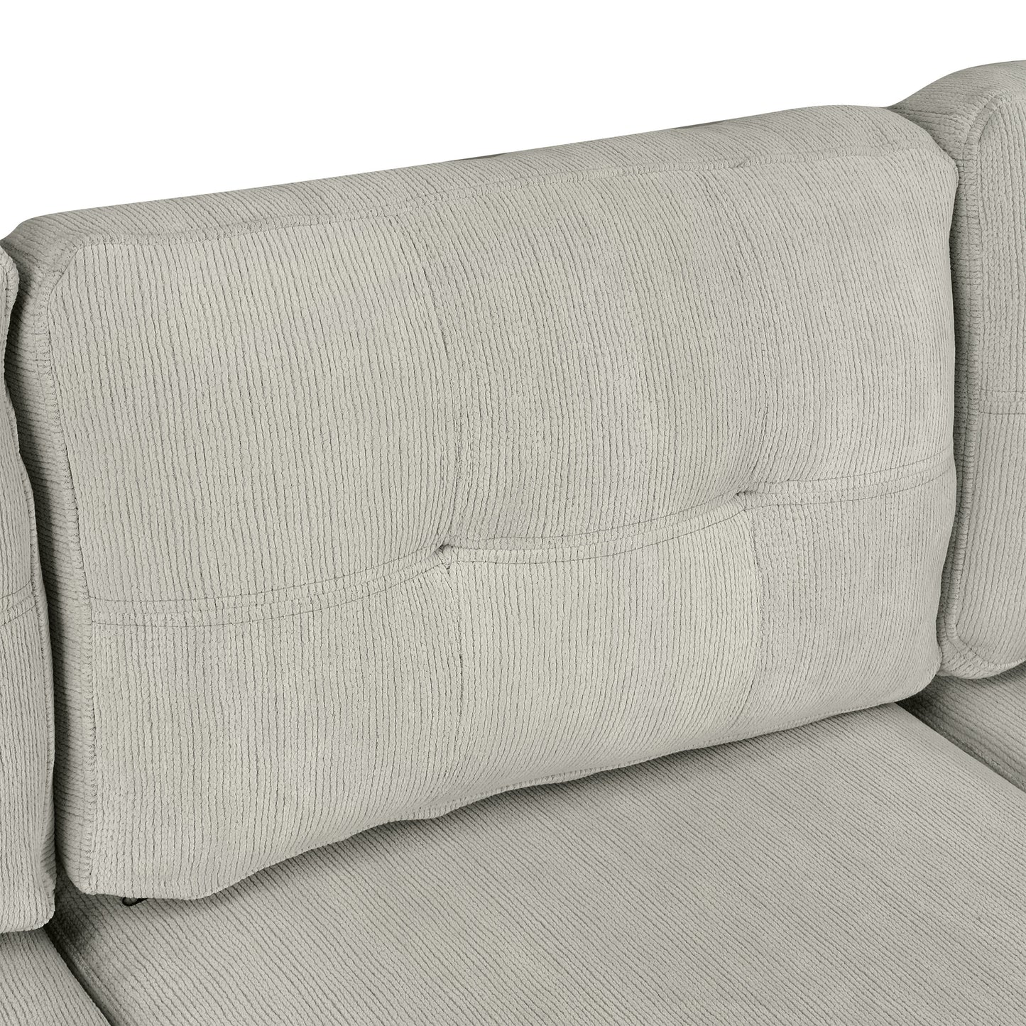 Closeup of plush grey corduroy sofa back cushion with tufted detail