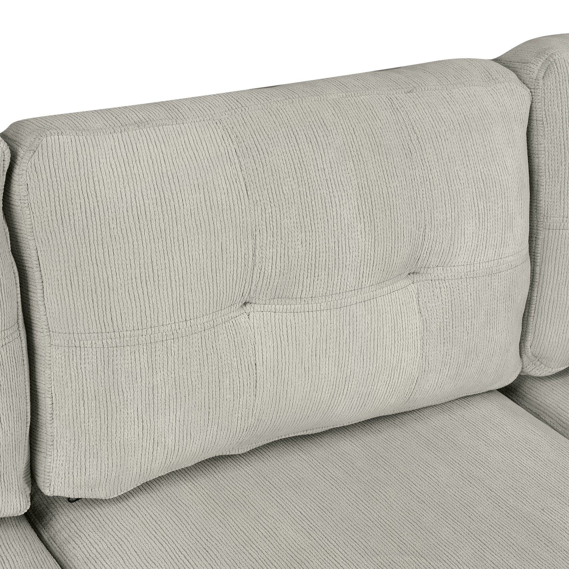 Closeup of plush grey corduroy sofa back cushion with tufted detail