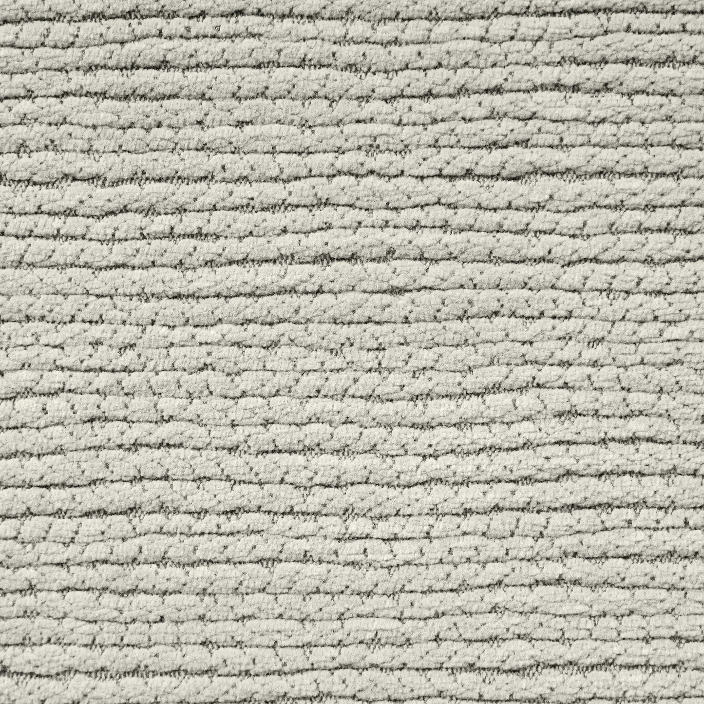 Closeup of a textured beige chenille fabric with horizontal ribbed detailing ideal for upholstery