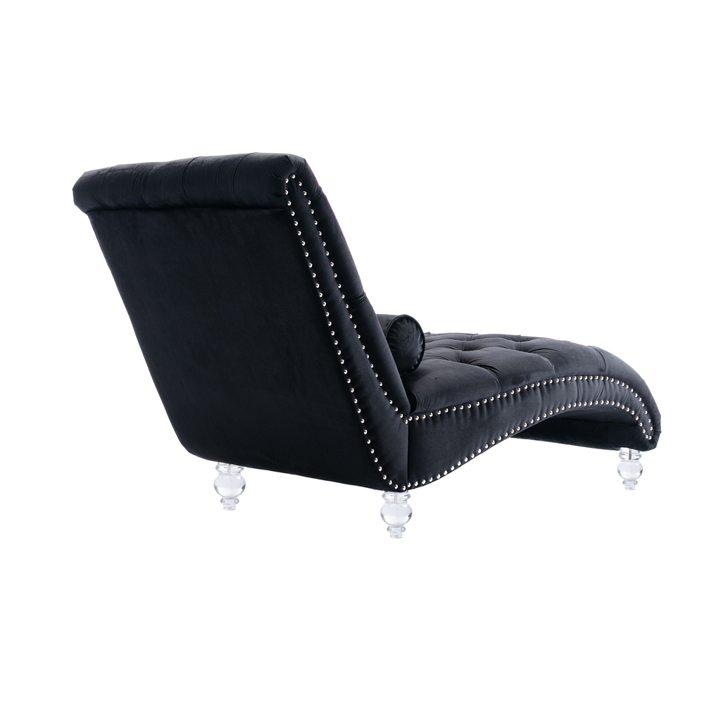 Black velvet chaise lounge with tufted seat and silver nailhead trim