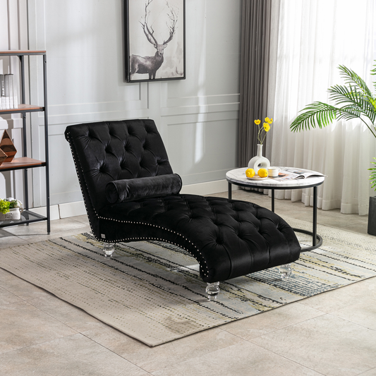 Black velvet chaise lounge with tufted back and crystal legs for elegant relaxation