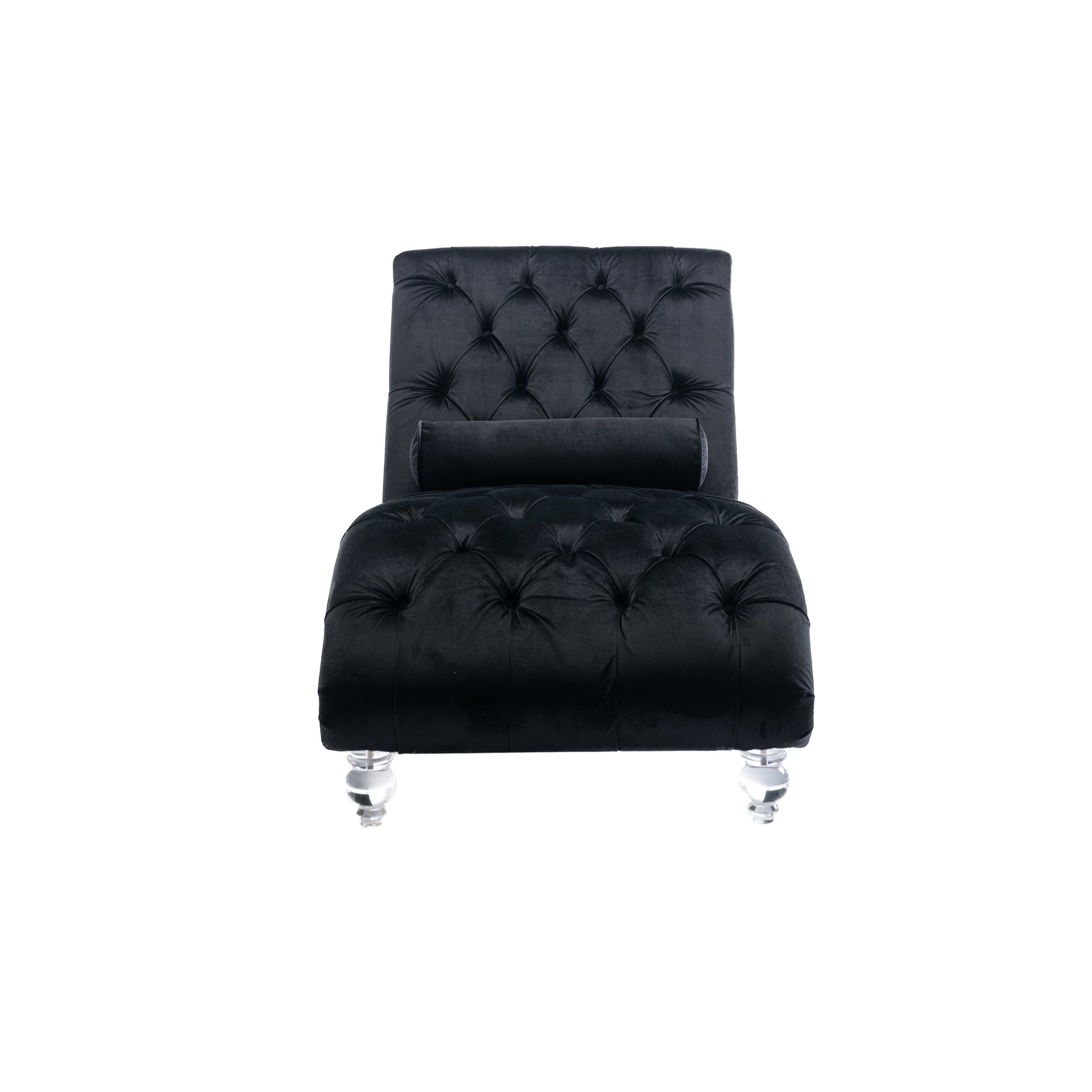 Black velvet tufted chaise lounge with cylindrical pillow and crystal legs