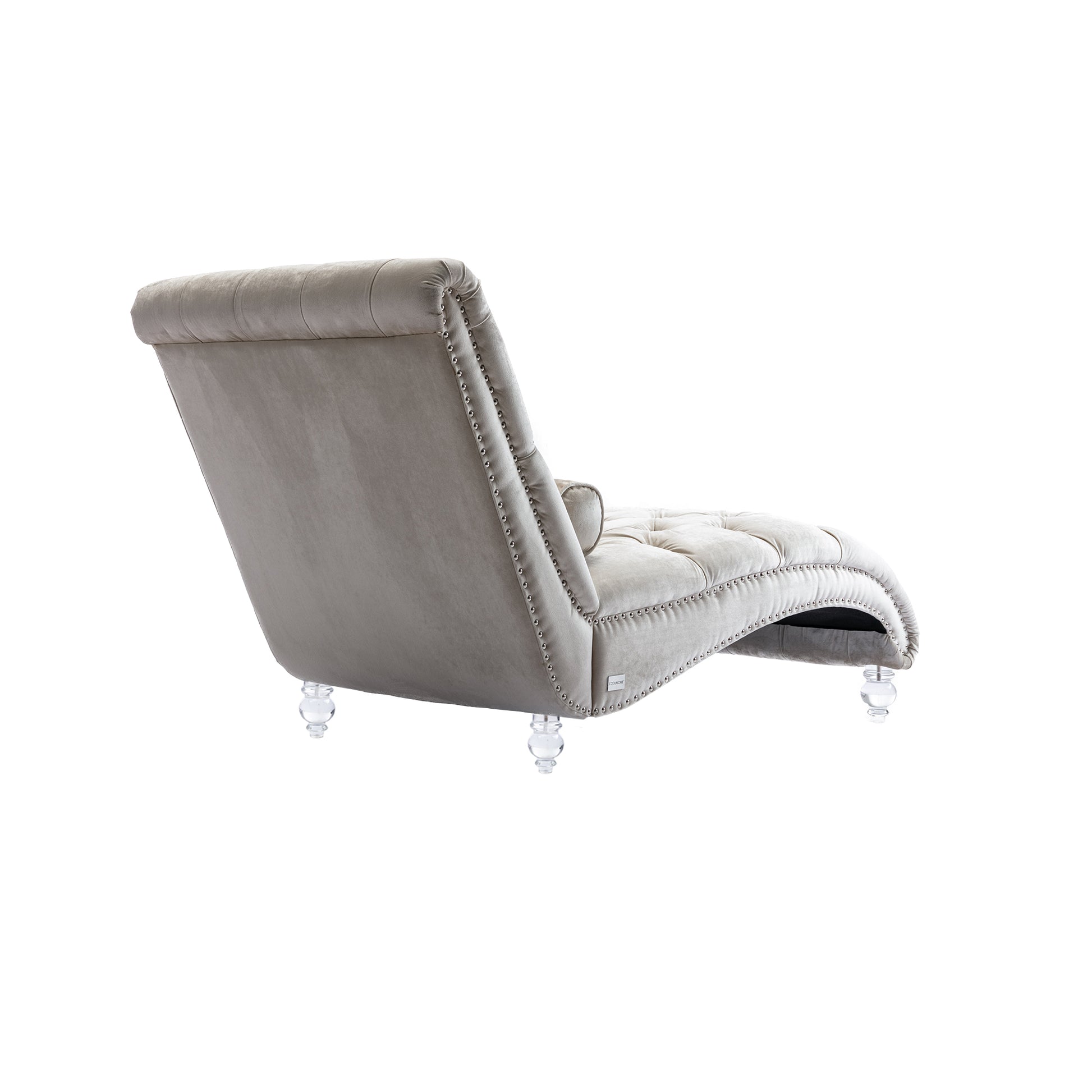 Plush velvet chaise lounge in light grey with crystal legs and ornate stud detailing