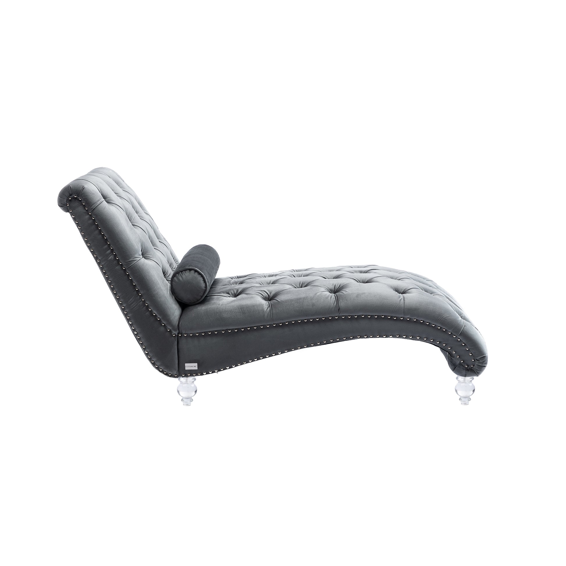 Grey velvet chaise lounge with button tufting and decorative nailhead trim