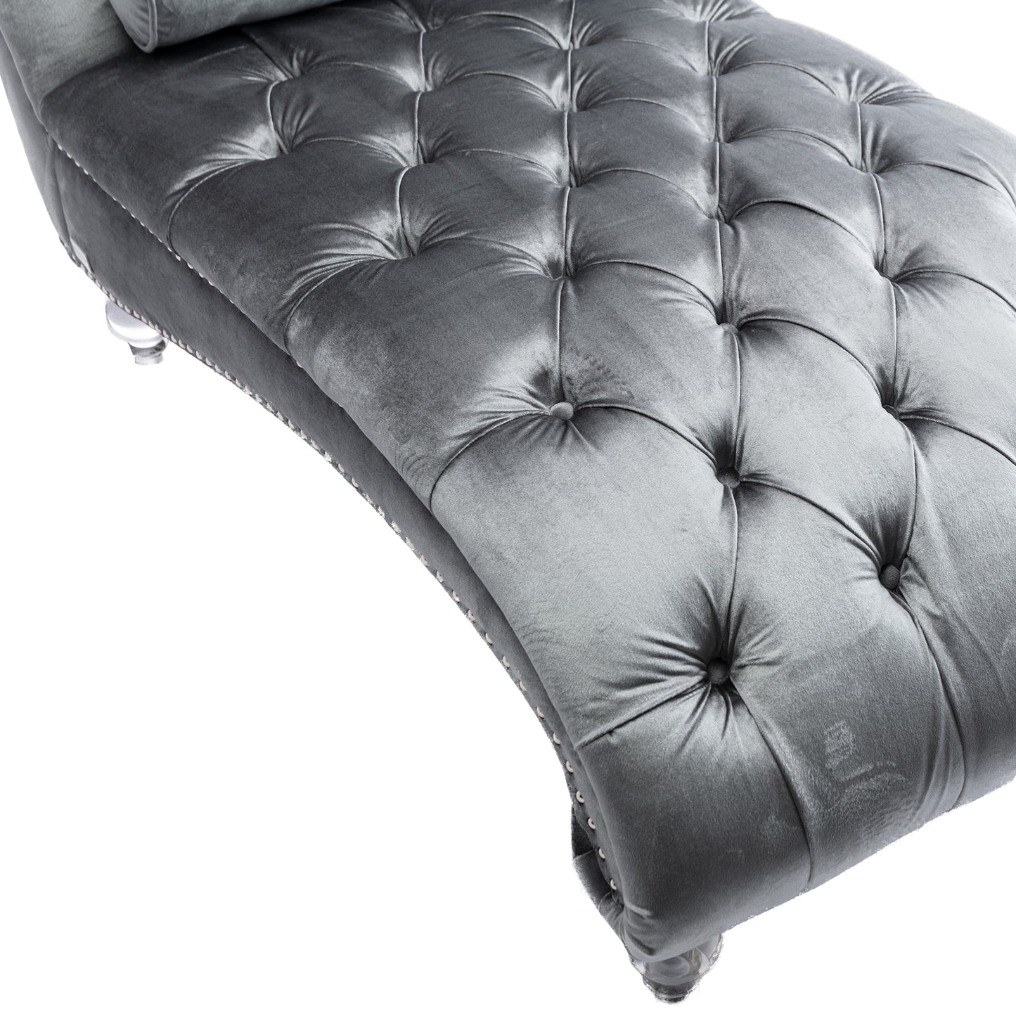 Plush grey velvet chaise lounge with deep tufting and silver nailhead trim