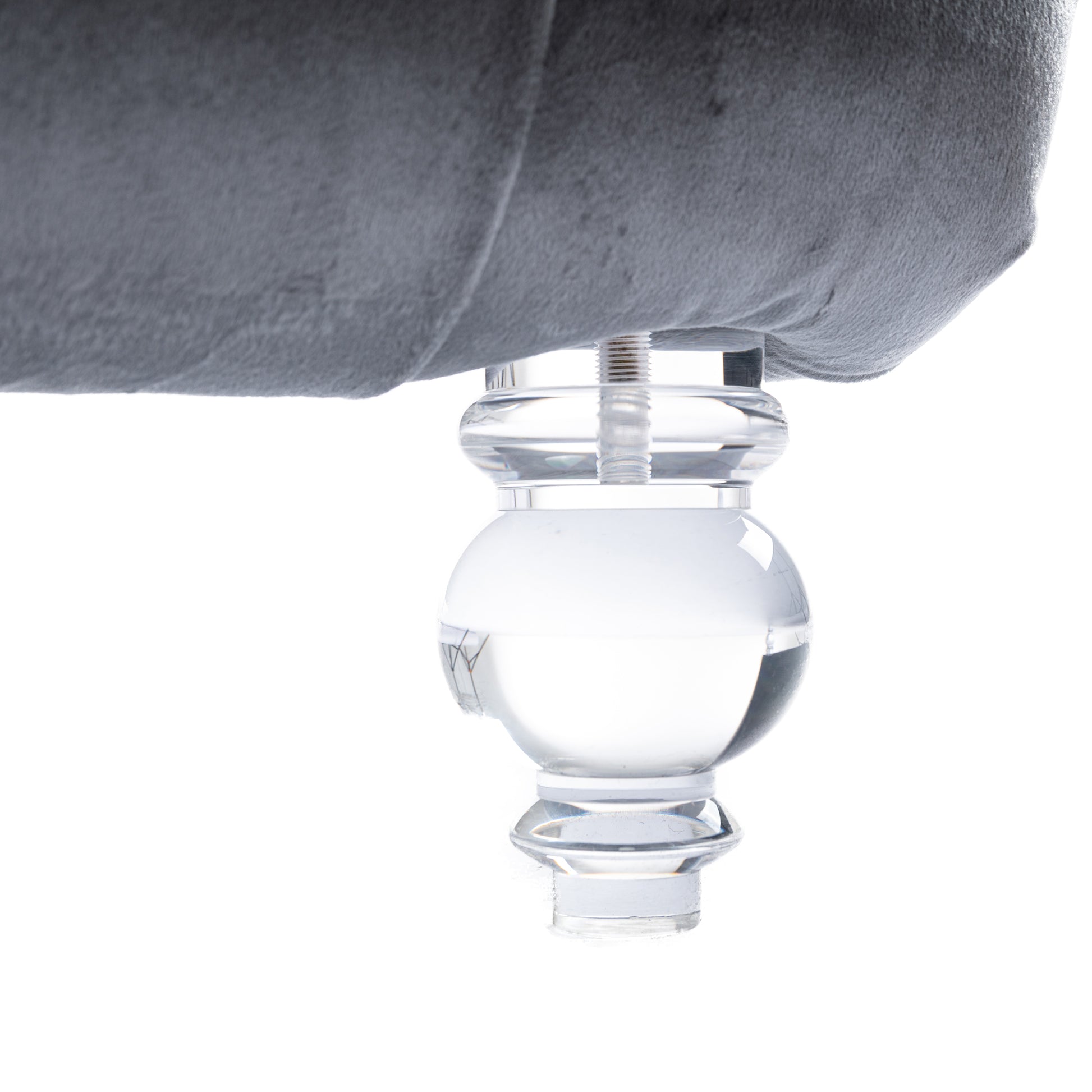 Clear acrylic furniture leg with ballshaped detail adds modern flair