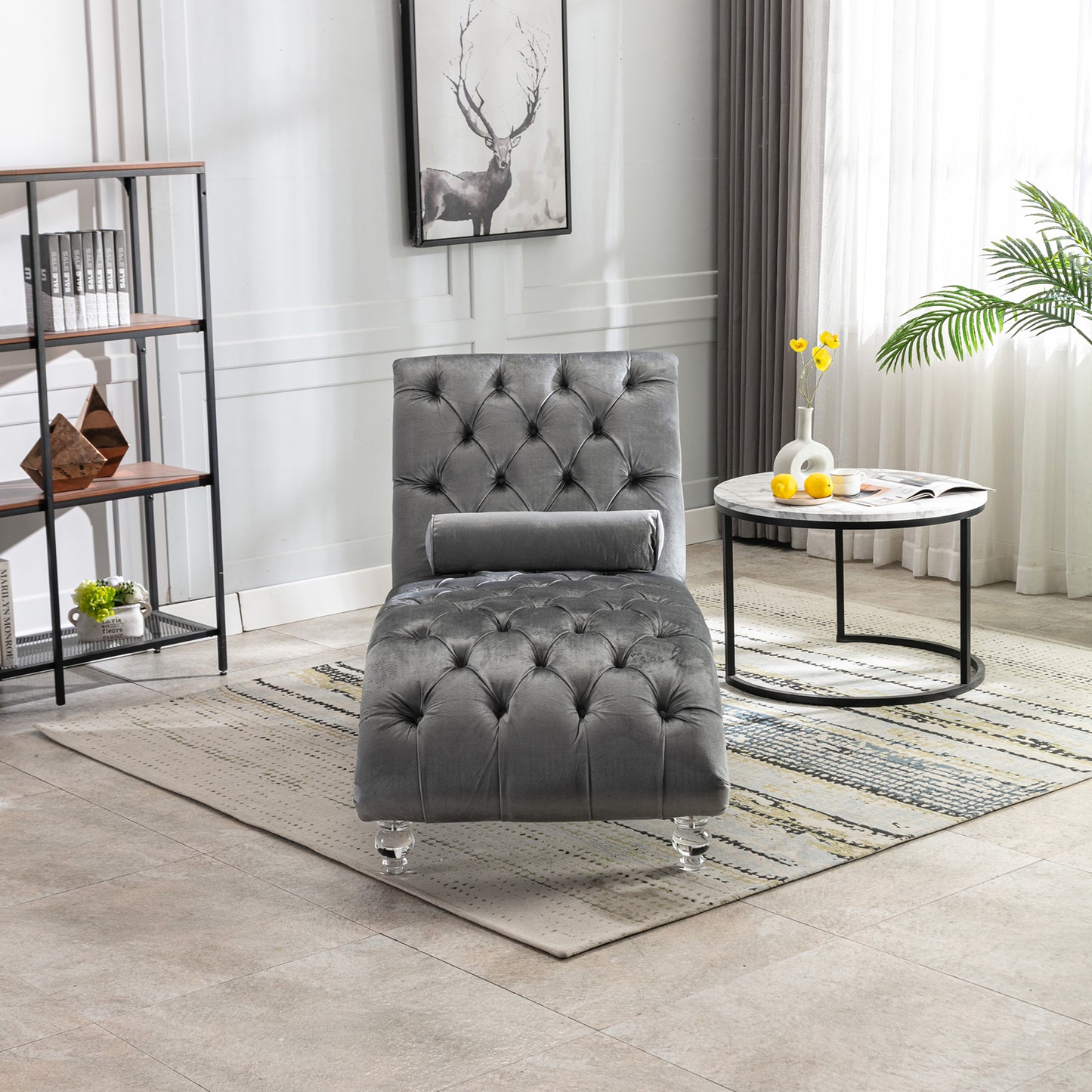 Grey velvet chaise lounge with tufted design and crystal legs perfect for living rooms