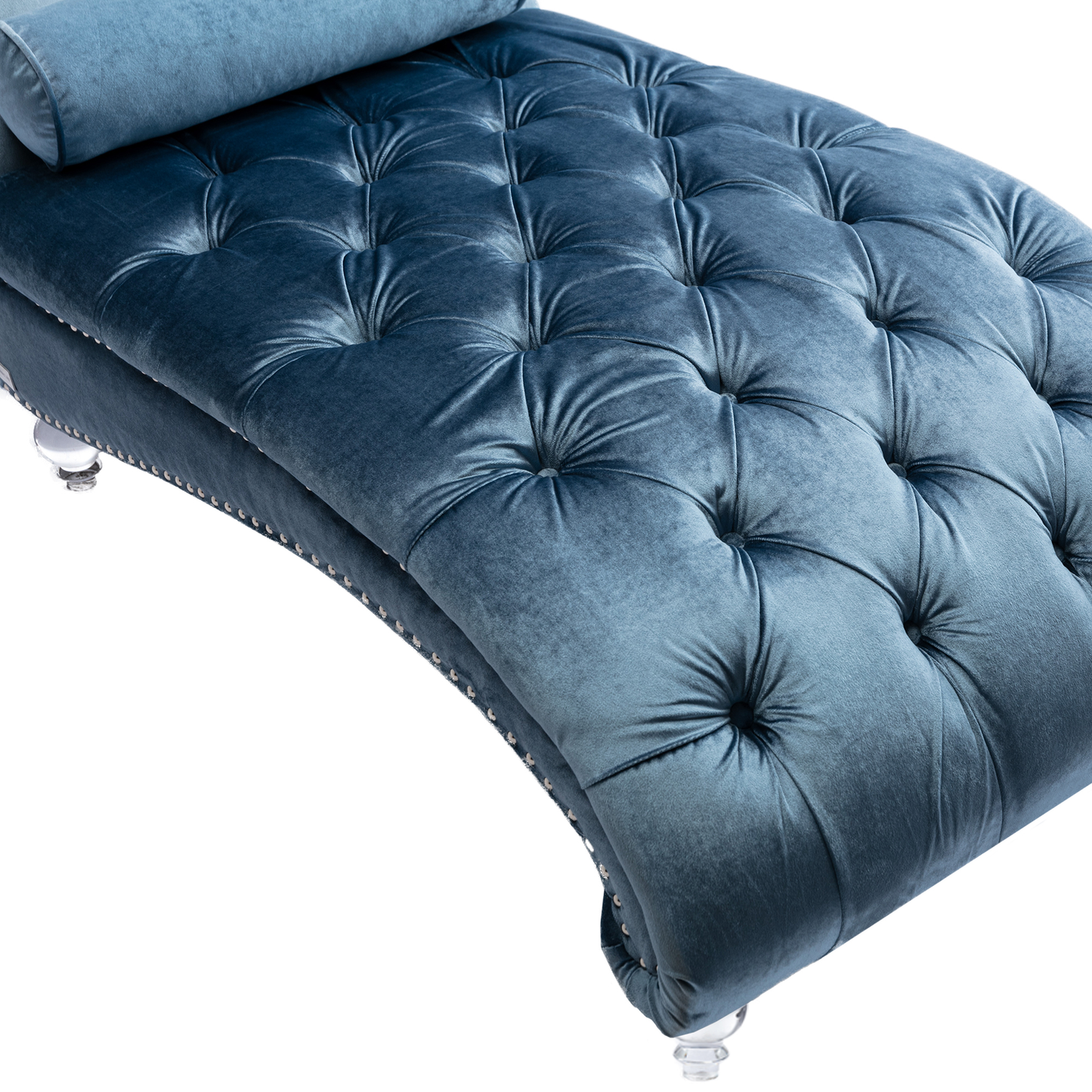 Deep blue velvet chaise lounge with tufted upholstery and silver nailhead trim detail