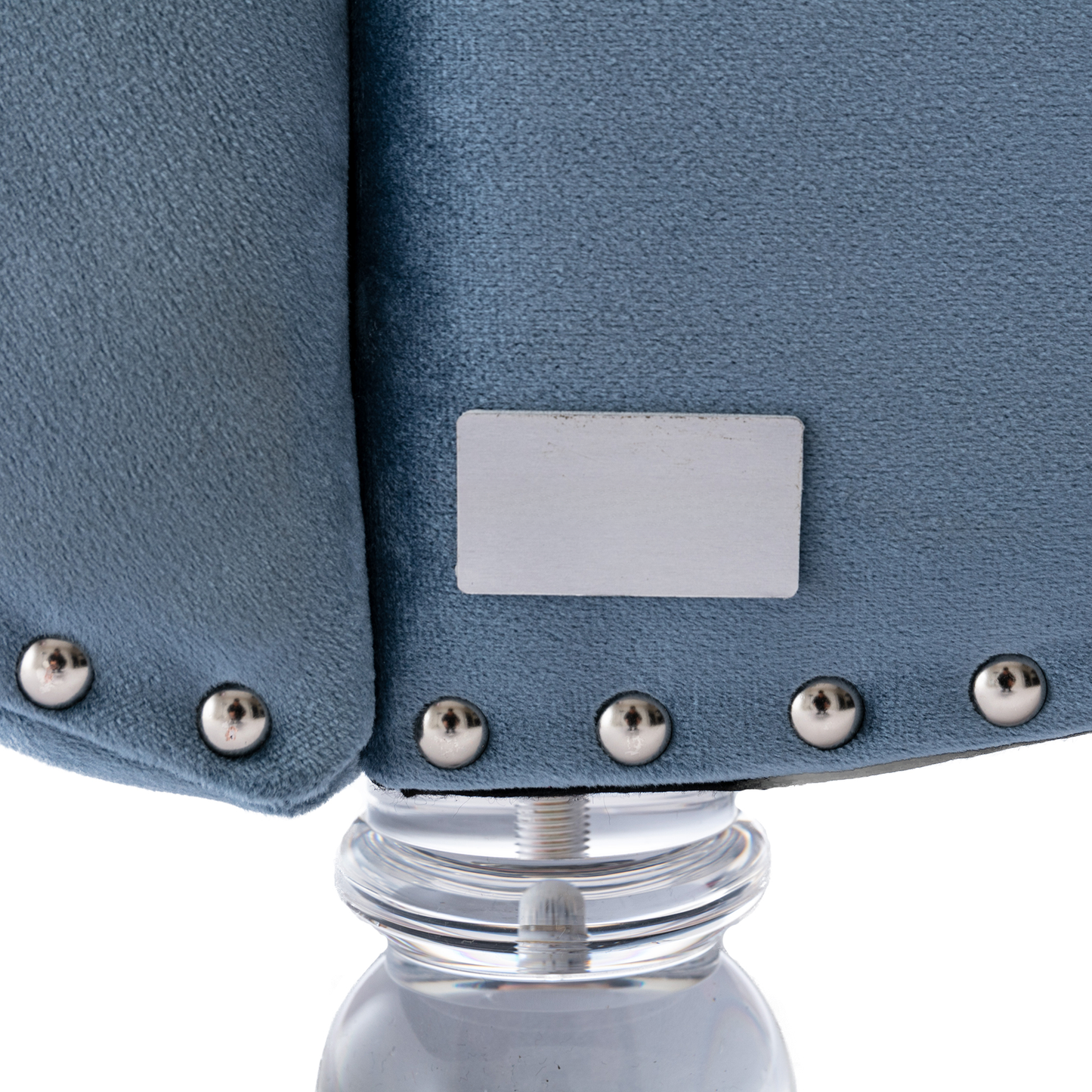 Blue velvet armchair details silver nailhead trim on plush fabric and clear acrylic leg