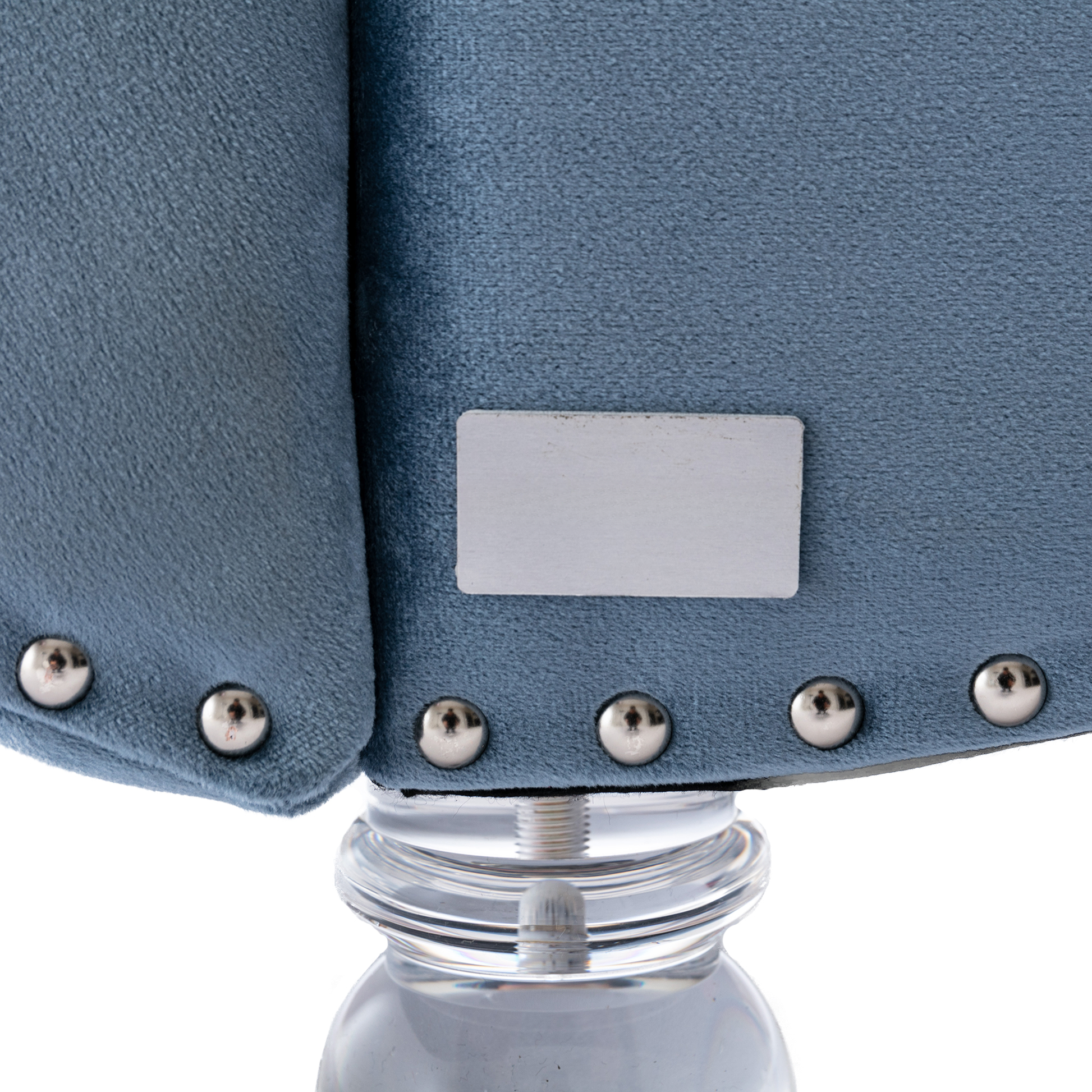 Blue velvet armchair details silver nailhead trim on plush fabric and clear acrylic leg