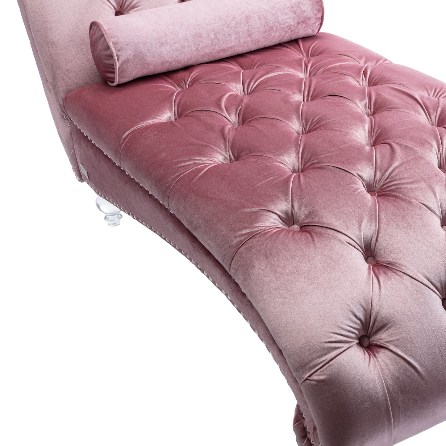 Dusty rose velvet chaise lounge with deep button tufting and a bolster pillow
