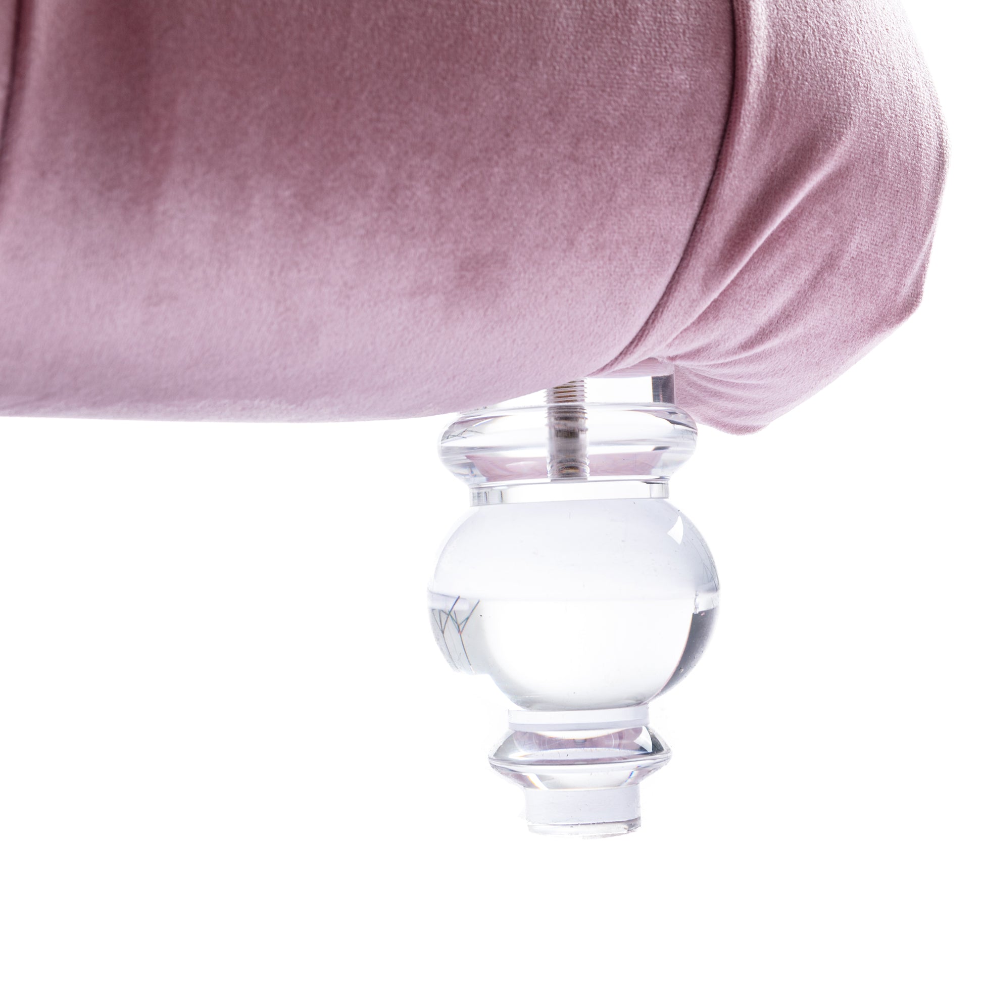 Elegant blush velvet sofa with ornate clear acrylic leg