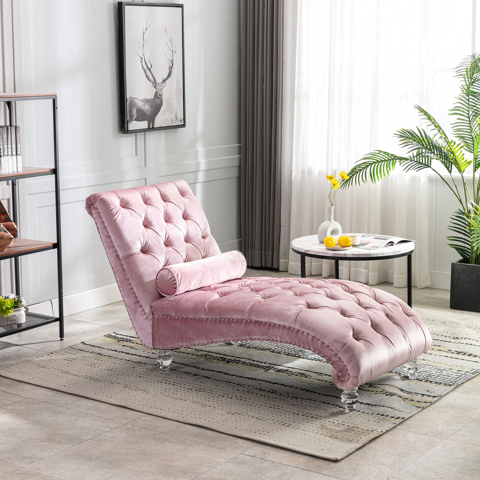 Pink velvet tufted chaise lounge with crystal legs and nailhead trim