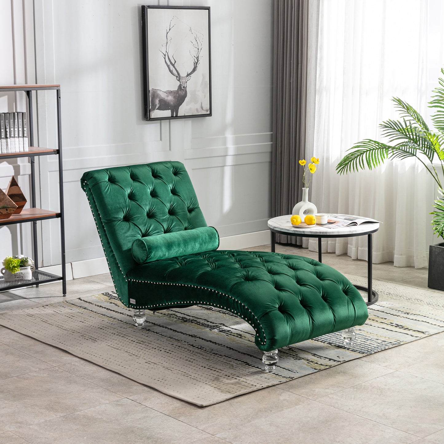 Deep green velvet tufted chaise lounge with silver nailhead trim and crystal legs