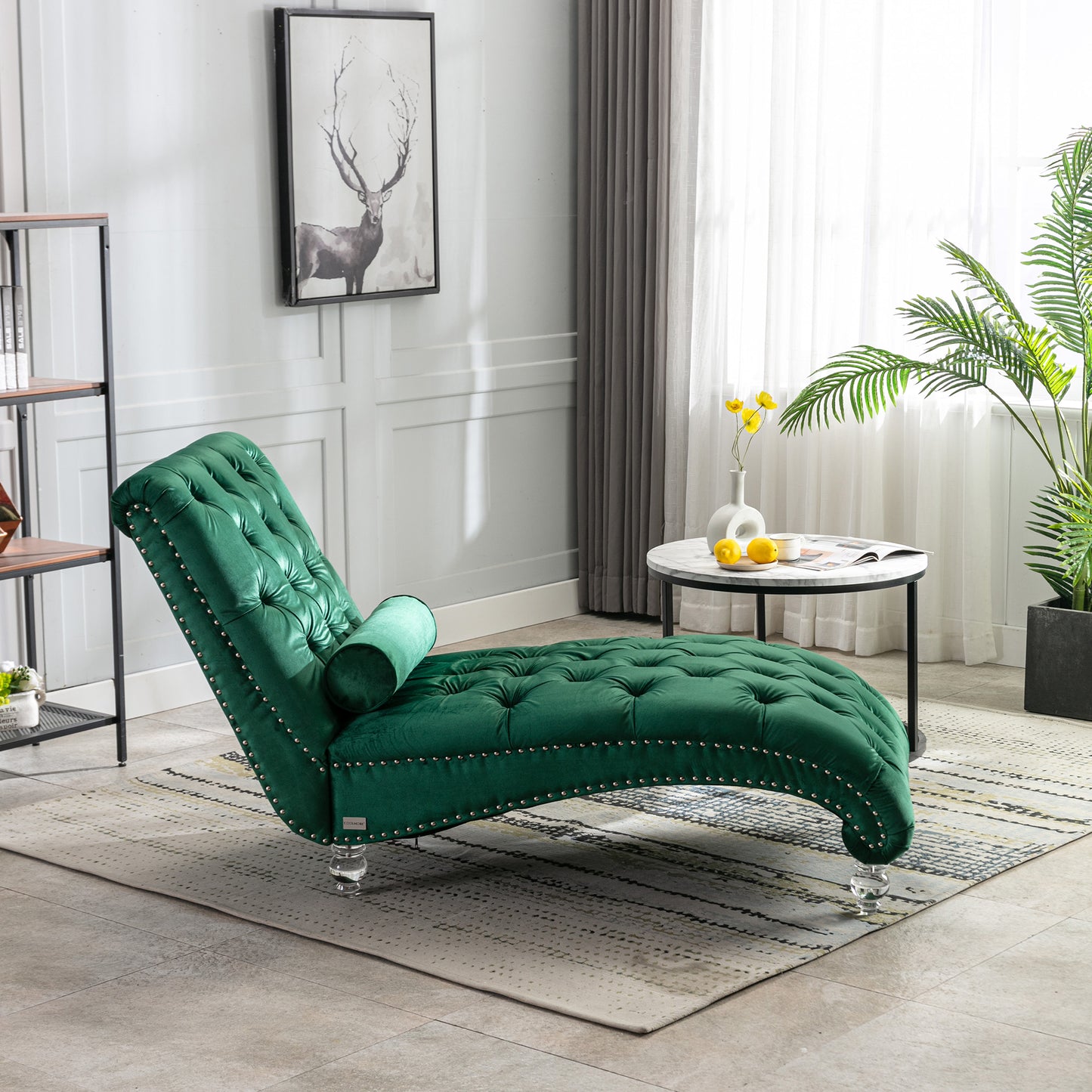 Emerald green velvet tufted chaise lounge with silver nailhead trim and acrylic legs