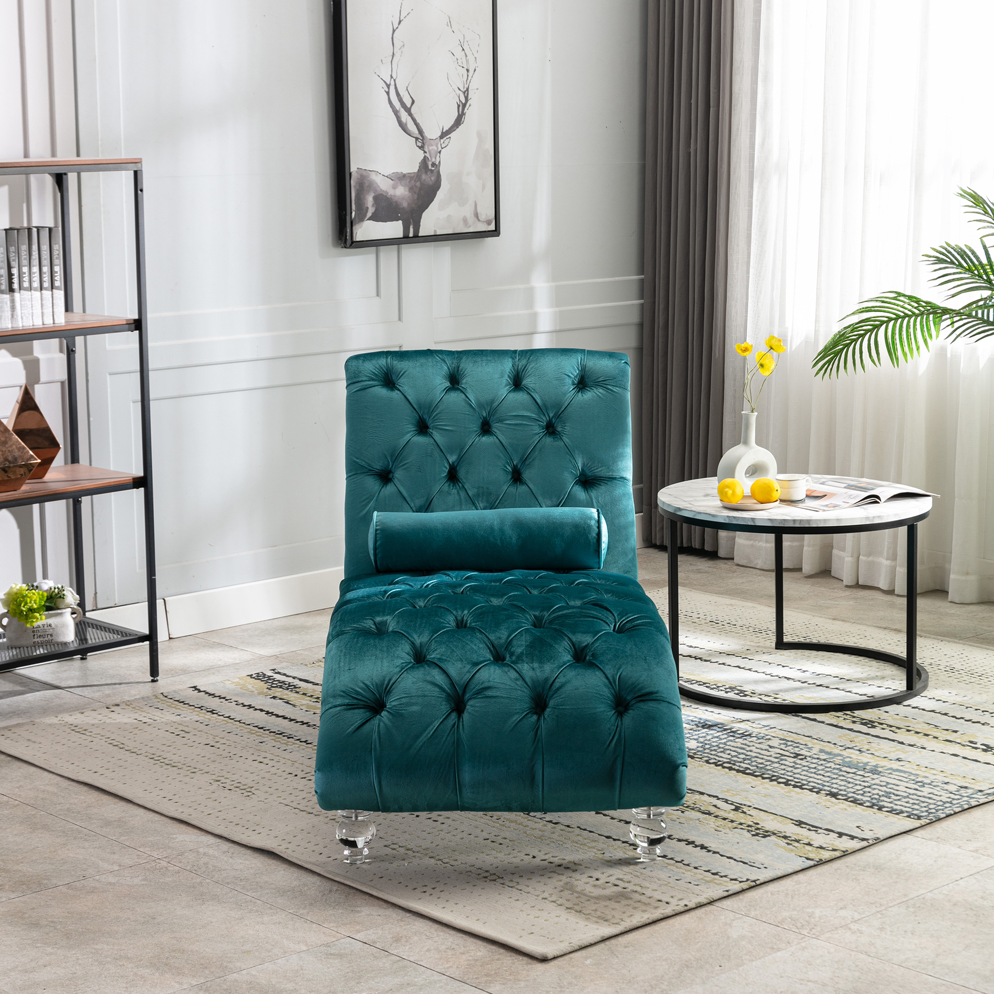 Teal velvet tufted chaise lounge with a bolster pillow and clear acrylic legs