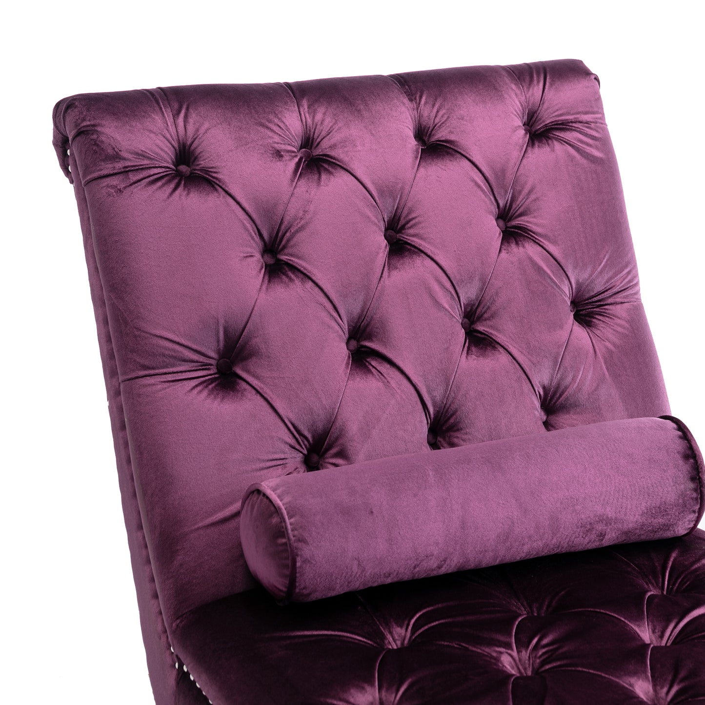 Plush purple velvet chaise lounge with tufted back and bolster pillow