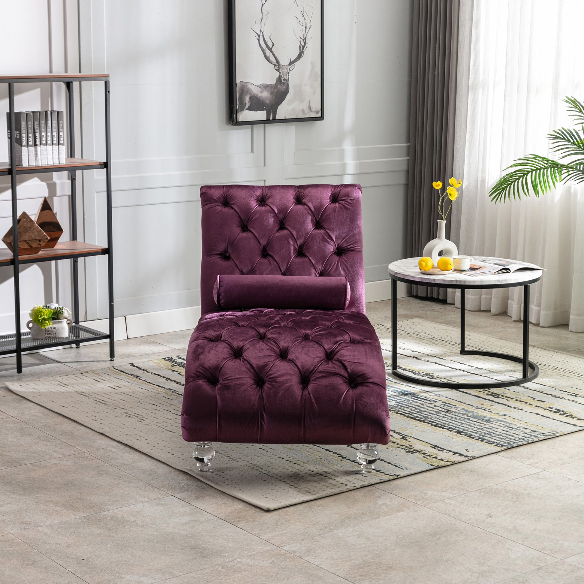 Deep purple velvet chaise lounge with tufted design and clear acrylic legs