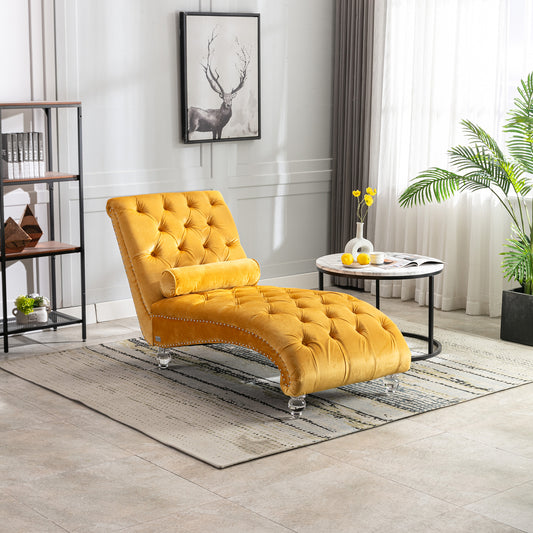 Tufted yellow velvet chaise lounge with nailhead trim and acrylic legs