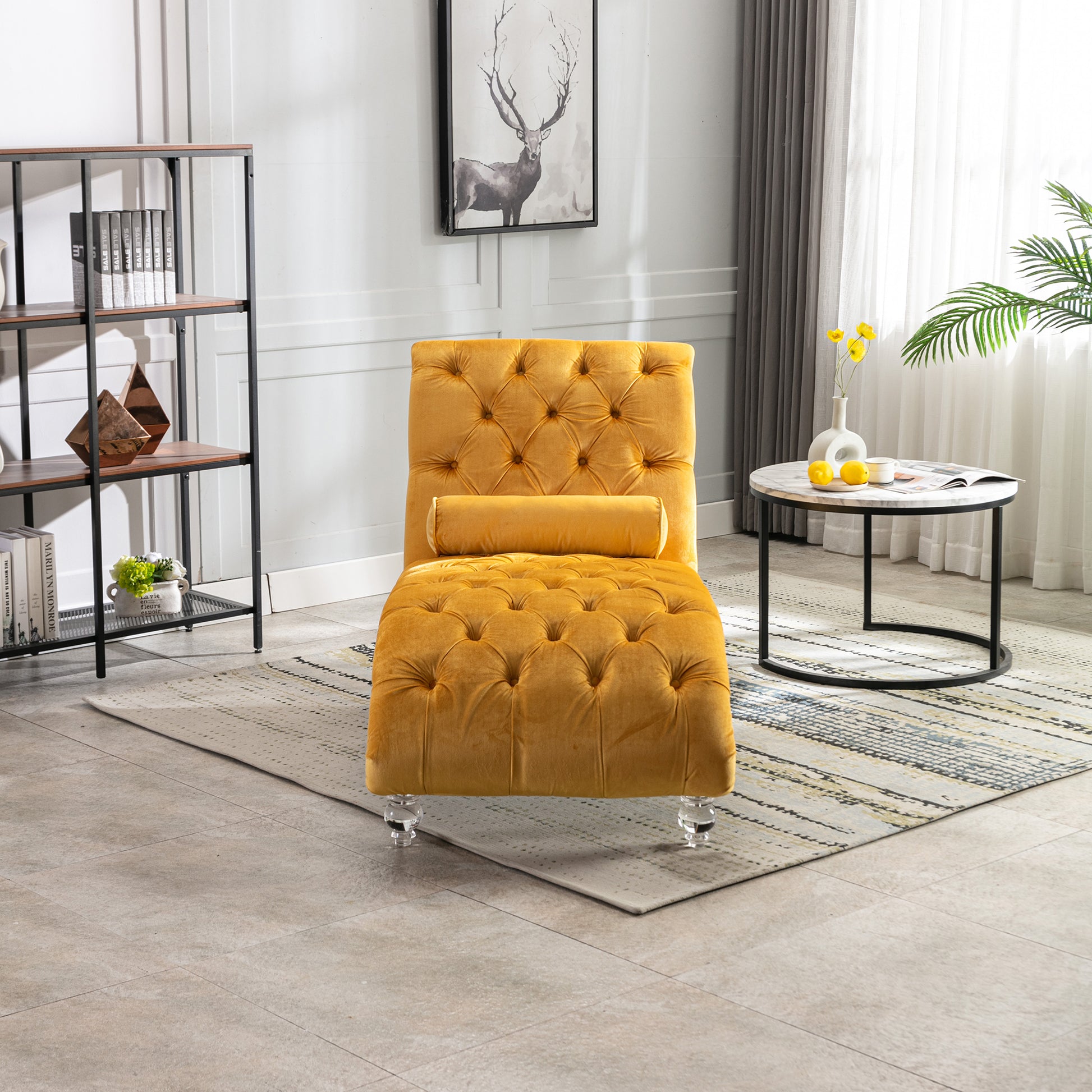 Tufted mustard velvet chaise lounge with clear acrylic legs and bolster pillow